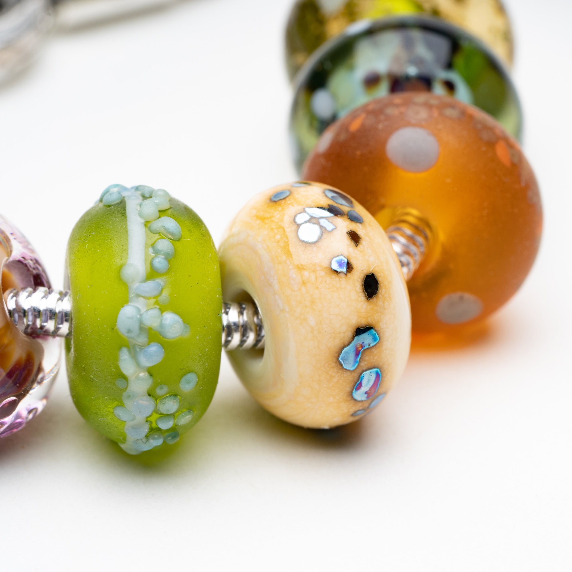 Borwn, green and cream earthy nature coloured glass beads representing the UK's national parks and countryside.