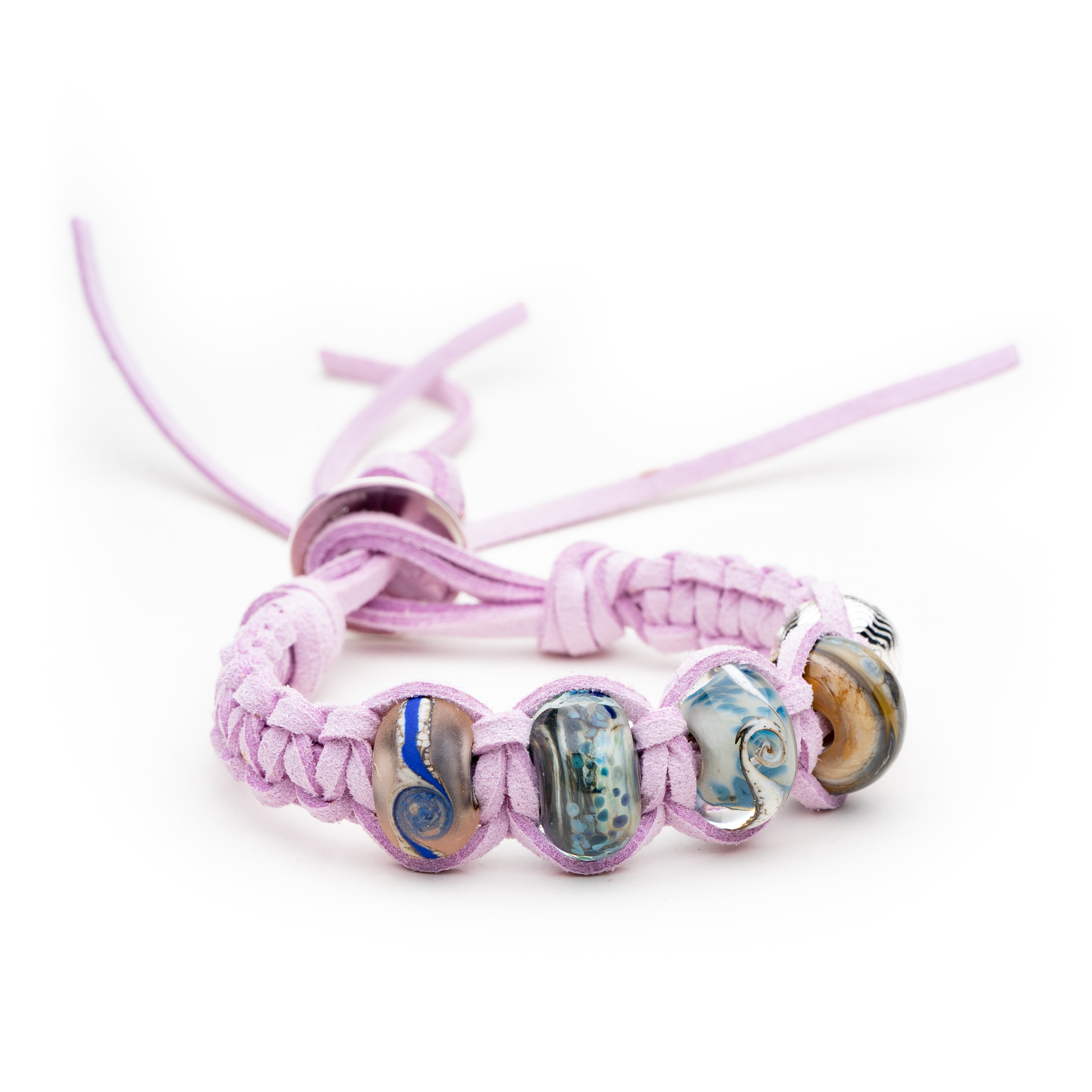Blue glass beads for Northumberland beaches on lilac coloured plaited macrame style bracelet