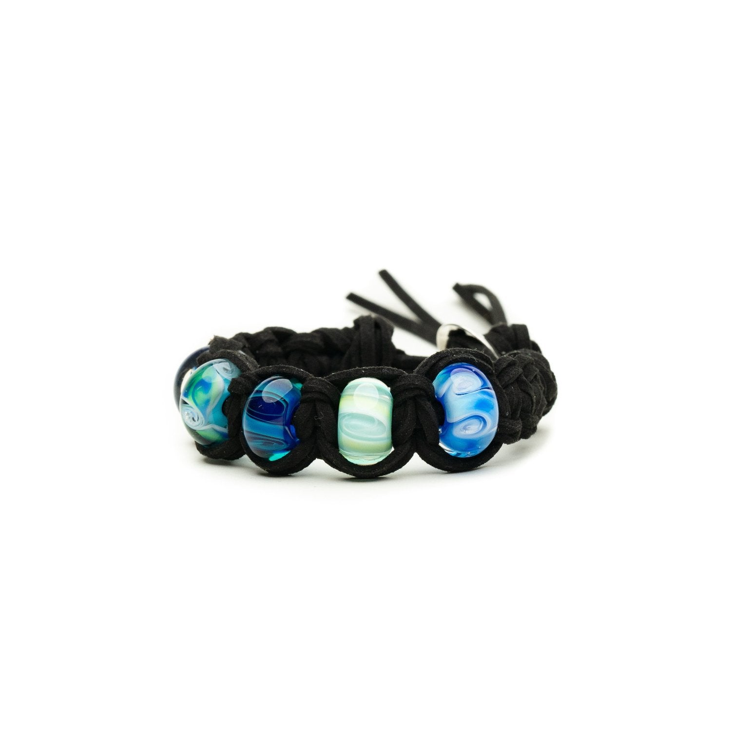 Black cord bracelet with green and blue swirling glass beads.