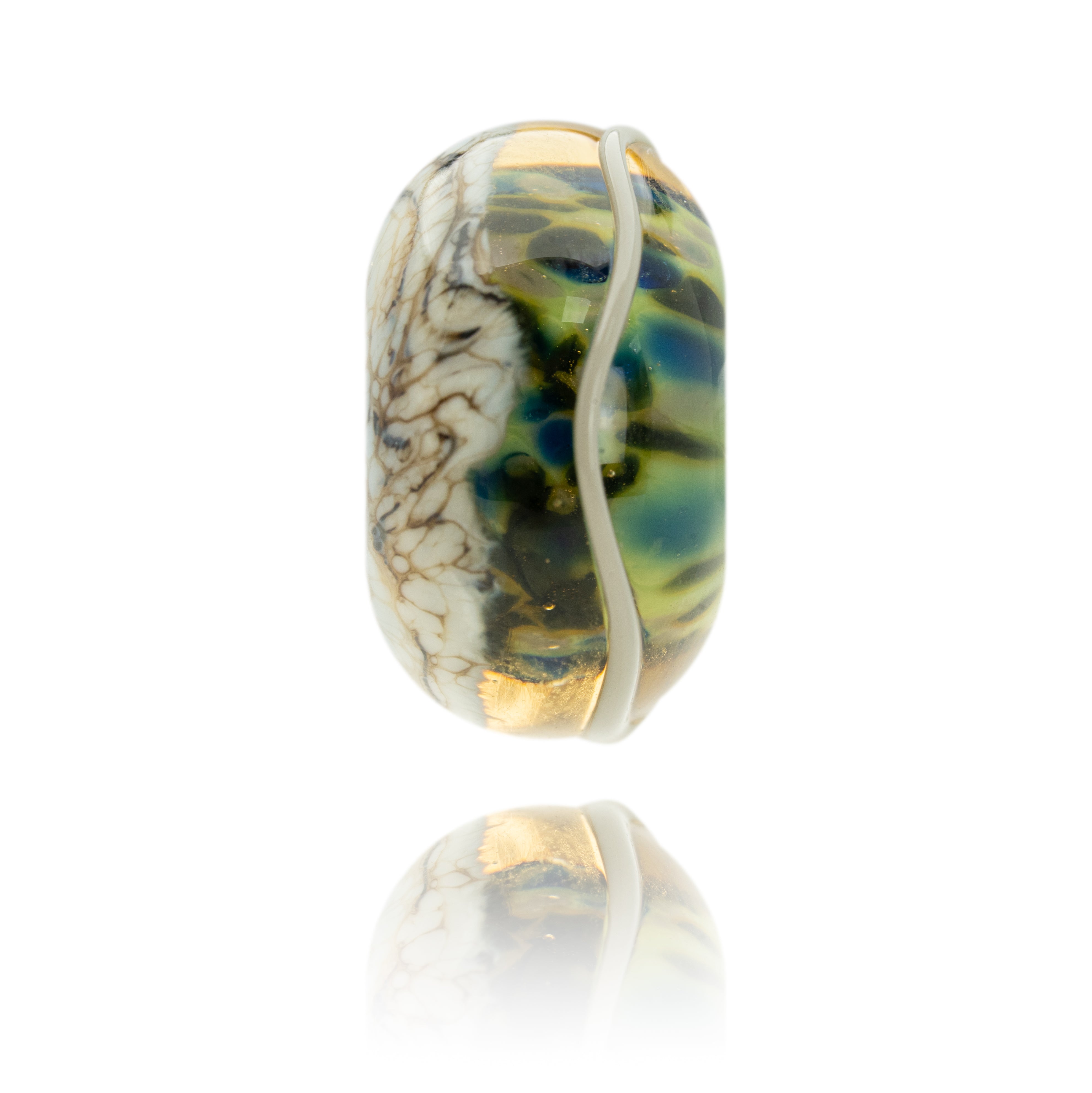 Green, brown and black mottled glass bead with grey pattern on white background.