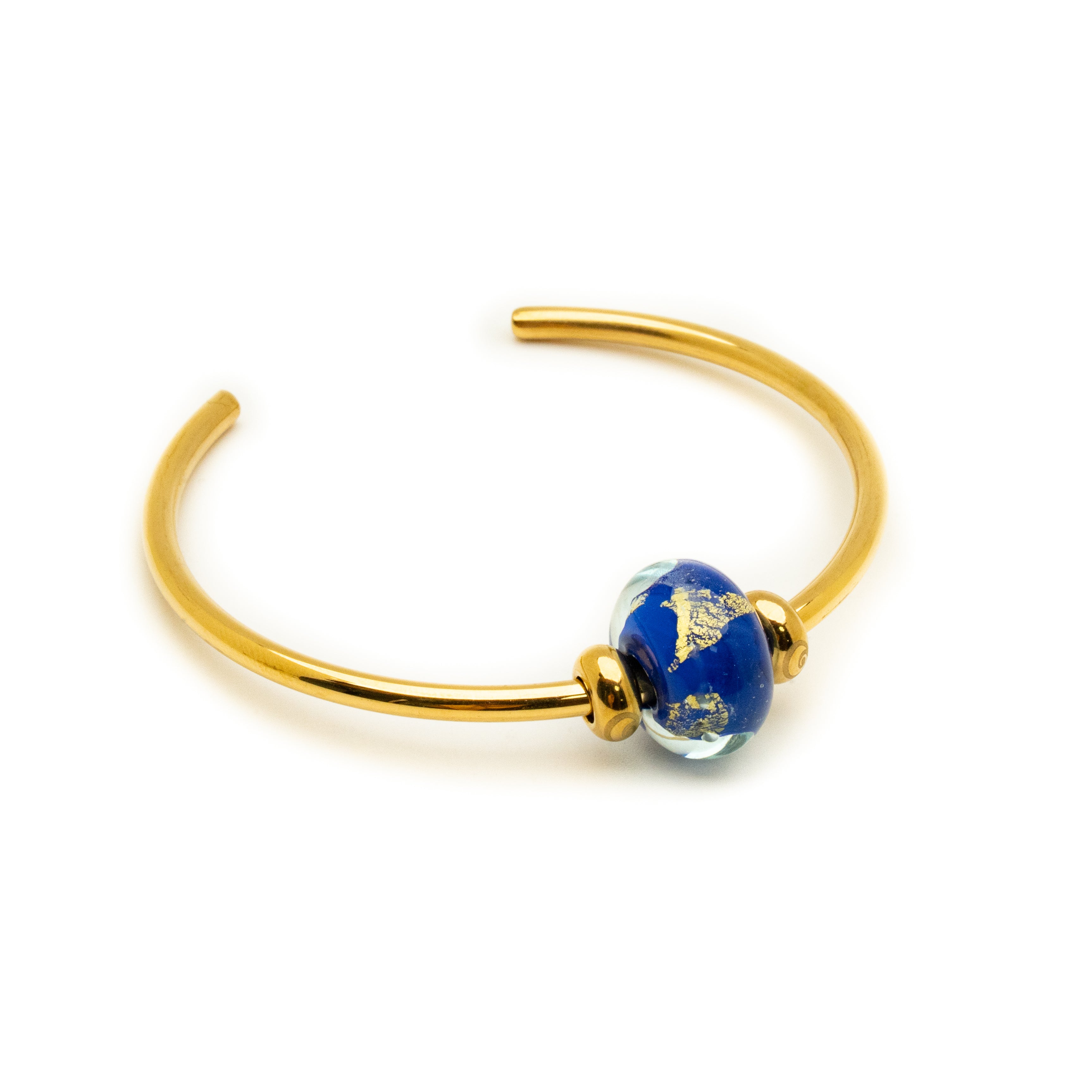 Gold bracelet with a blue beaded charm on a white background