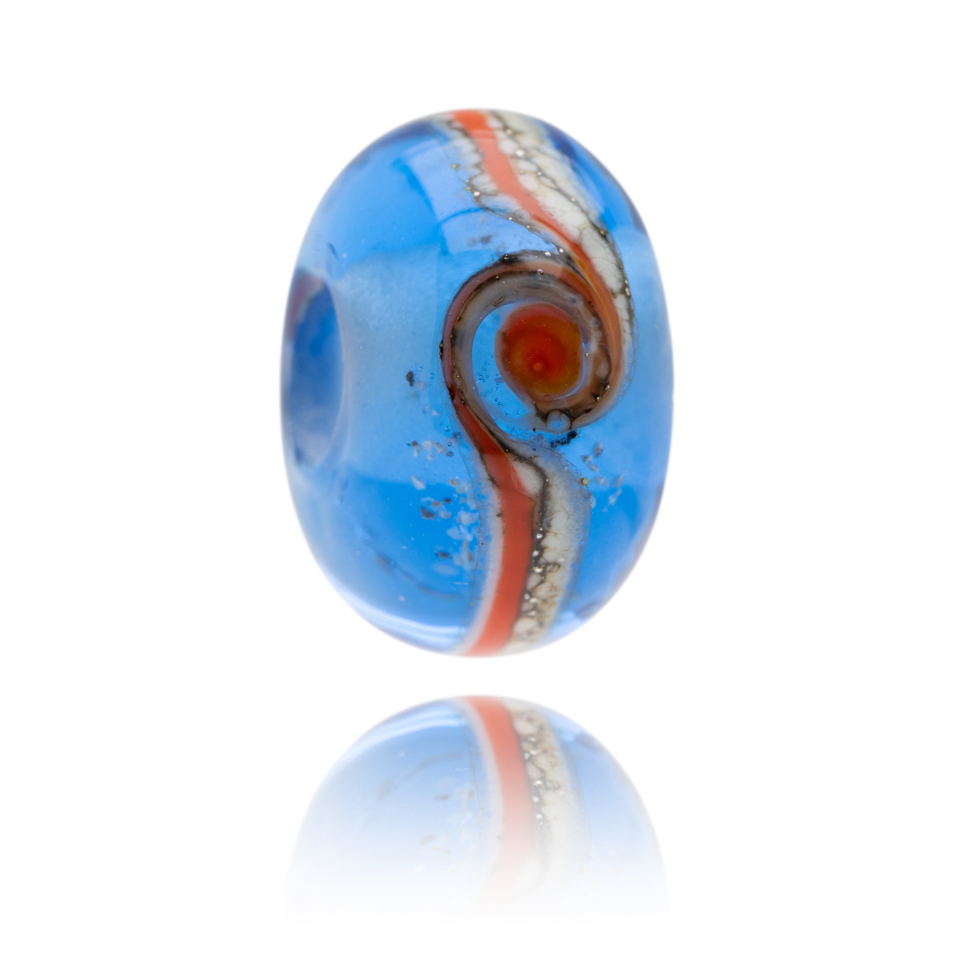 A multicolored bead with blue, red, and orange layers, possibly made of glass with a metallic finish.