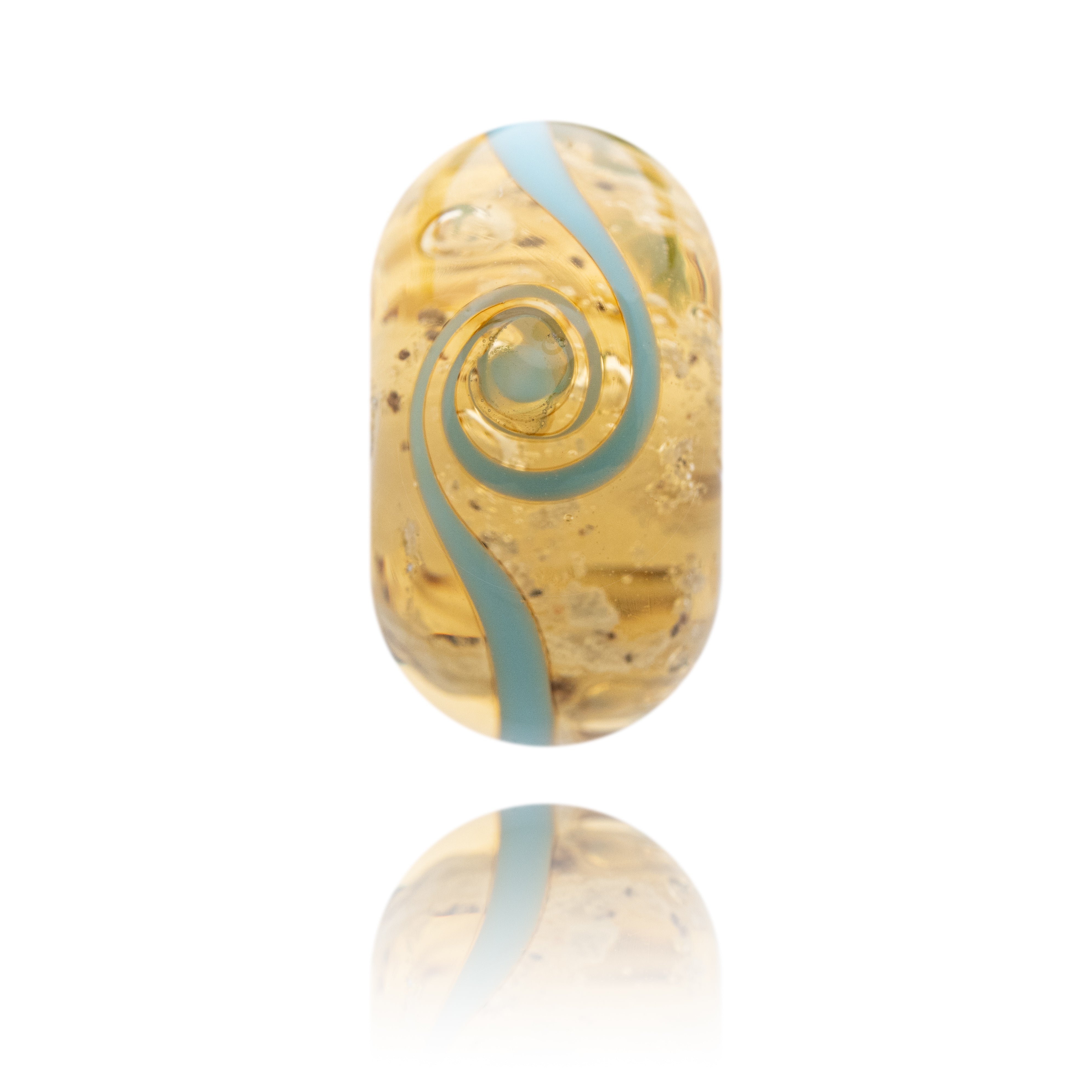 Gold and blue glass bead on a white background