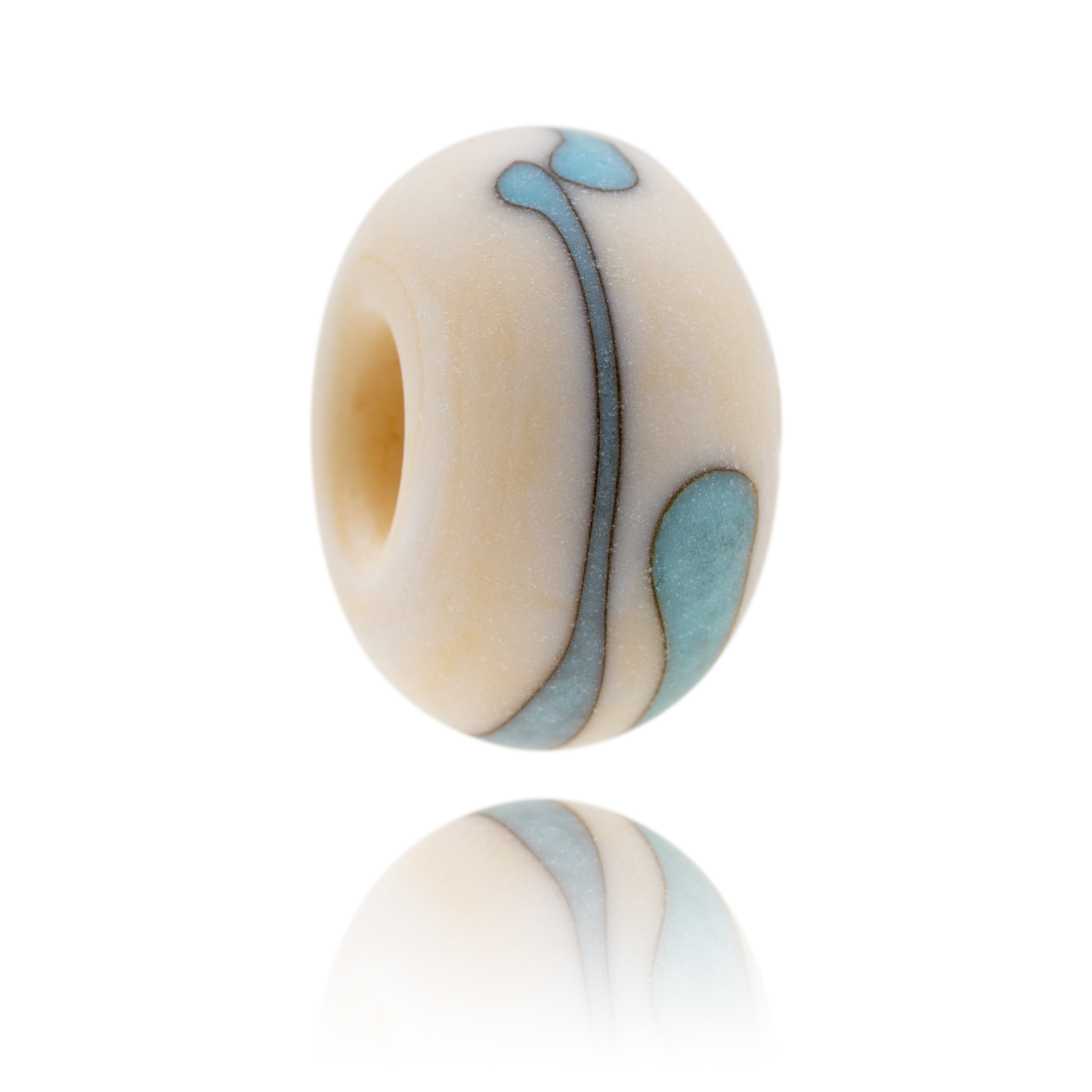 Sandy coloured glass bead with turquoise stipe pattern on the surface, representing Brean in Somerset.