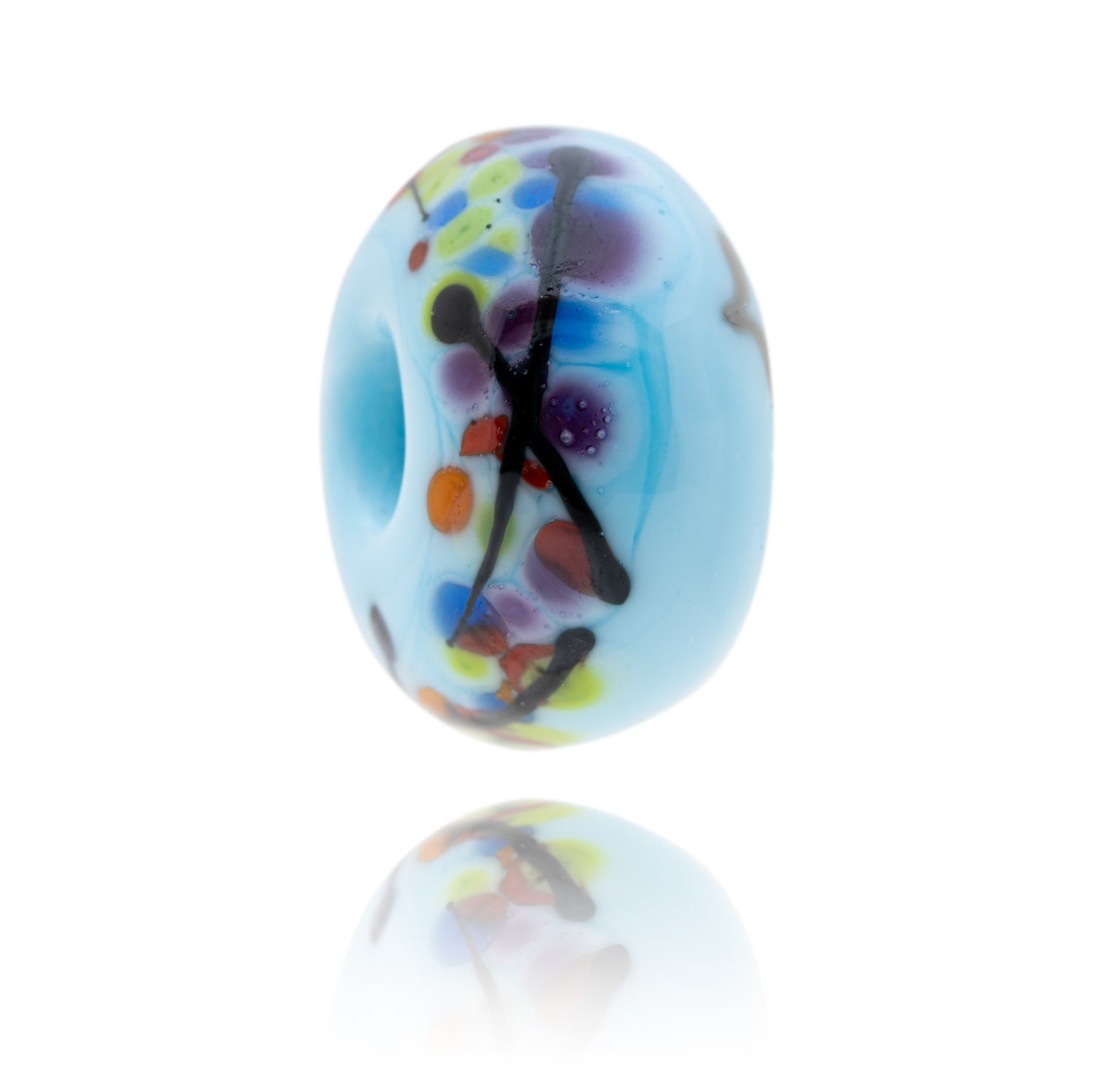 Pale blue glass bead with colourful dots and black stripes pin the surface, representing Brighton in Sussex.