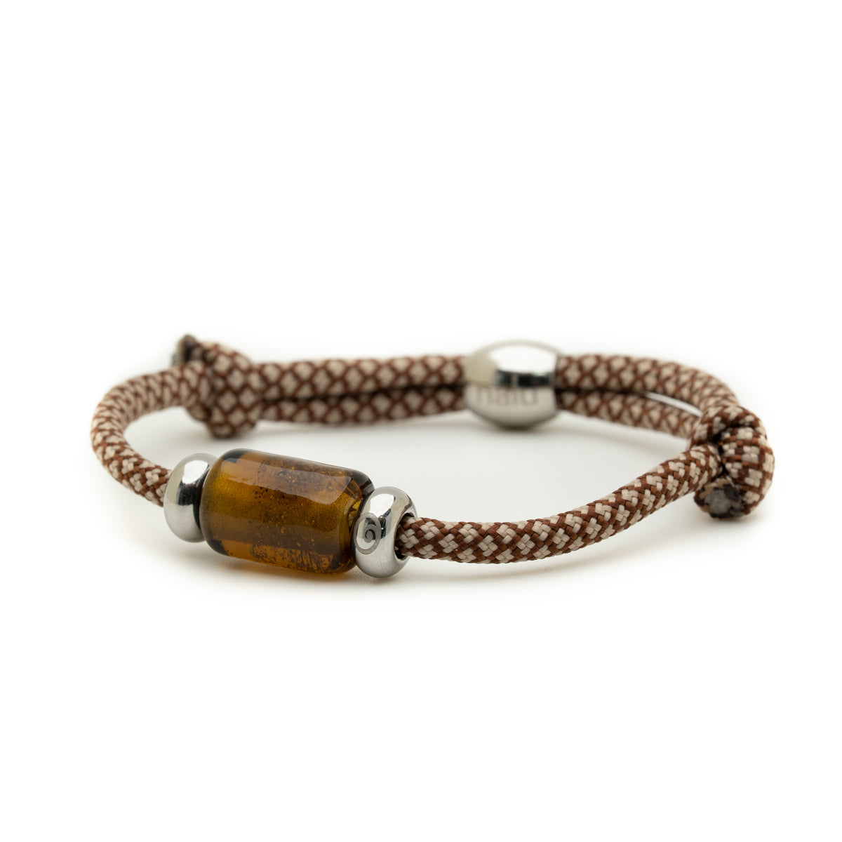 A braided brown and white cord bracelet with a central translucent amber-brown cylindrical bead and silver-toned metal caps, shown on a plain white background.