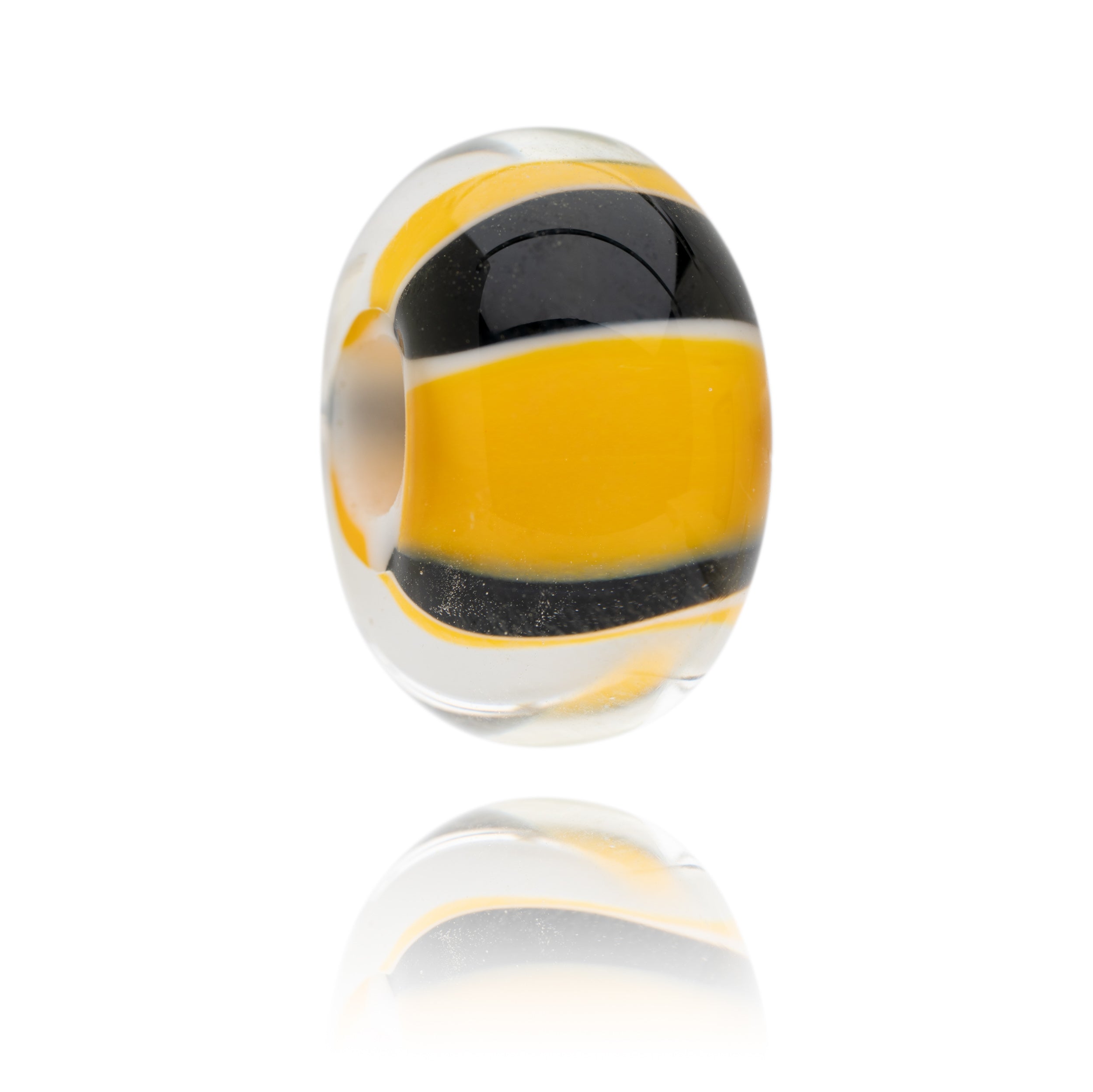 Yellow, black, white striped glass bead representing a bumblebee with proceeds being donated to the Bumblebee Conservation Trust.