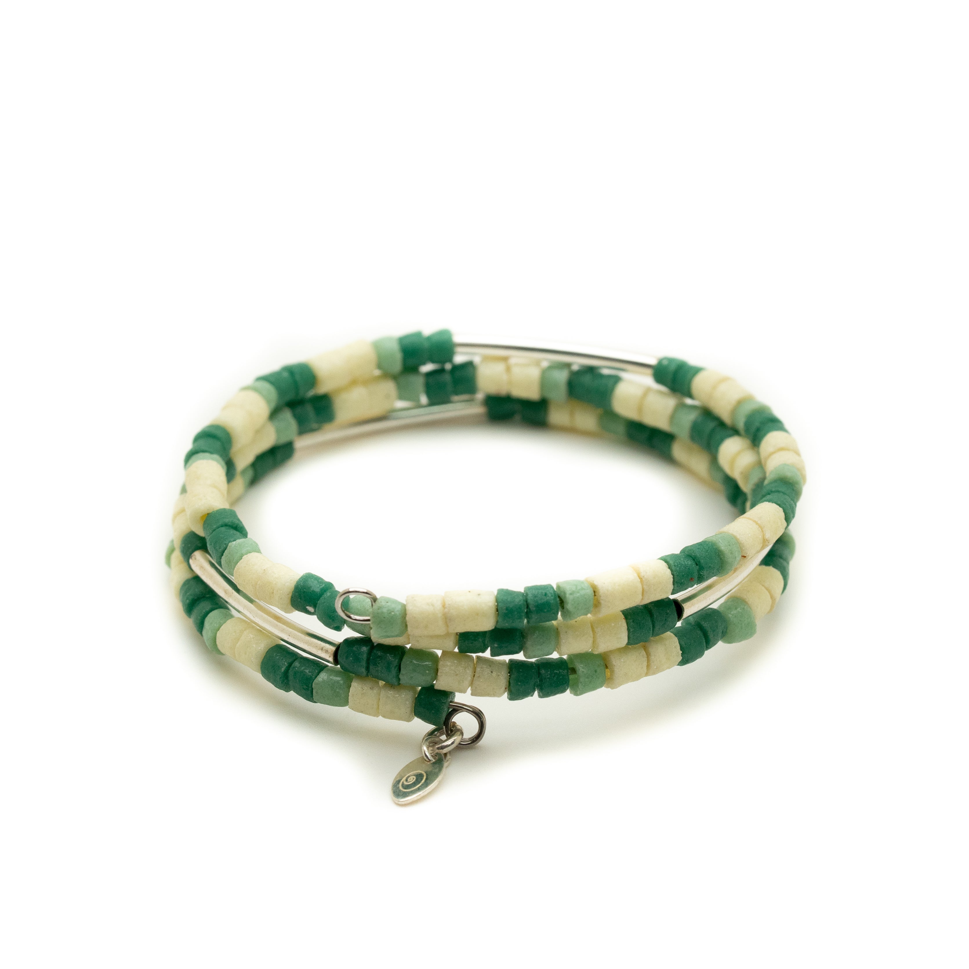 Green and white beaded bracelet on a white background