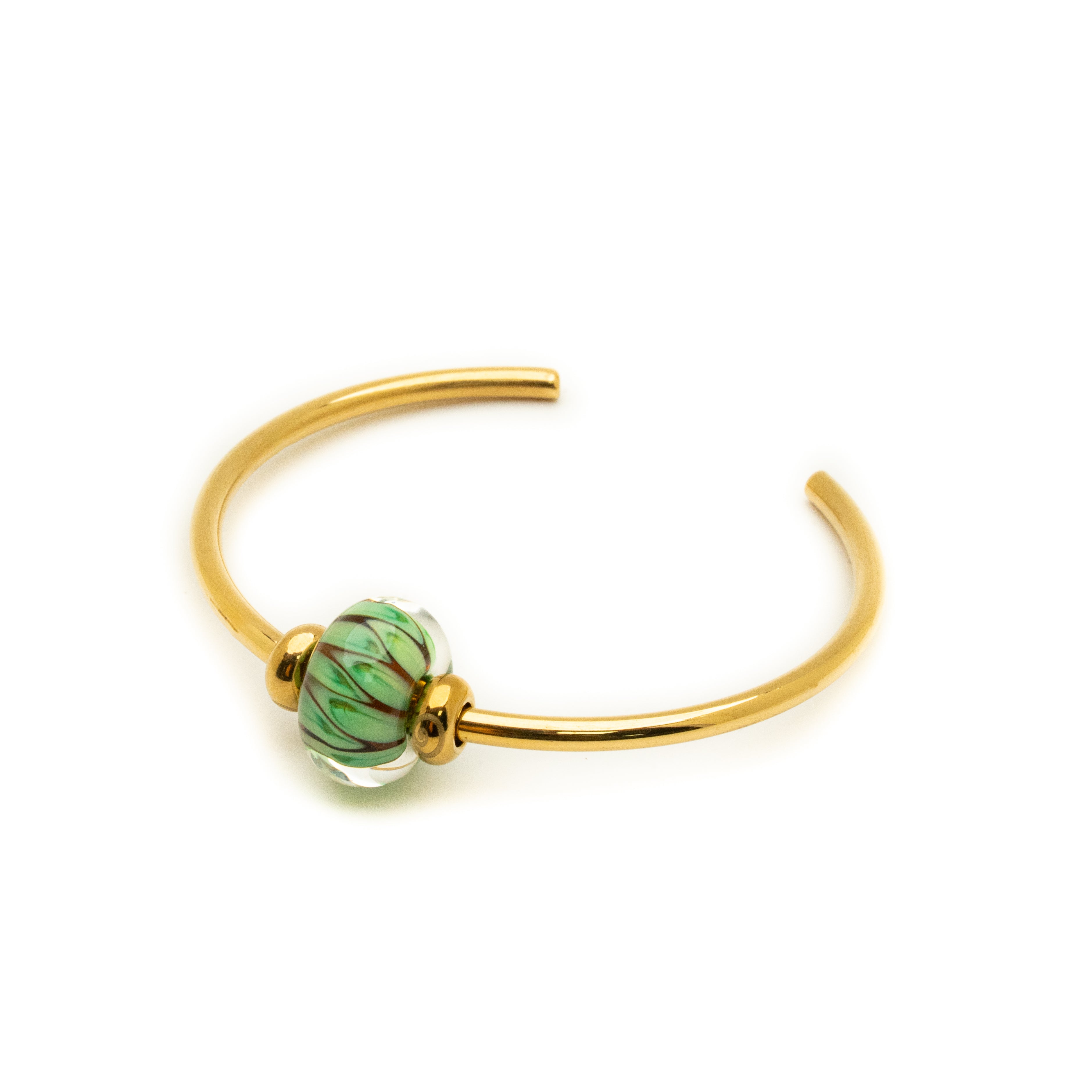 Gold bracelet with a green bead on a white background