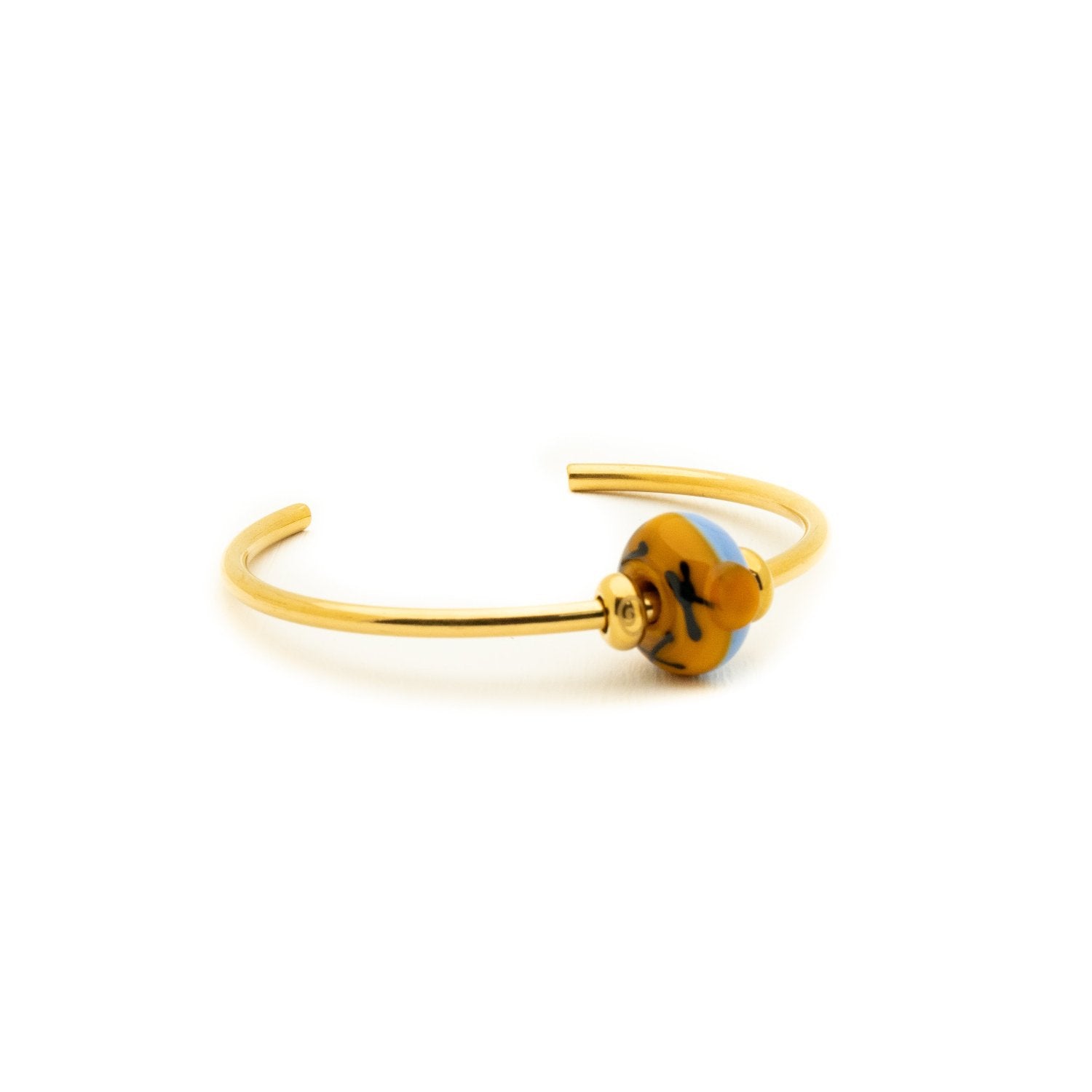 Orange and blue Cleethorthpes bead on a gold bangle.