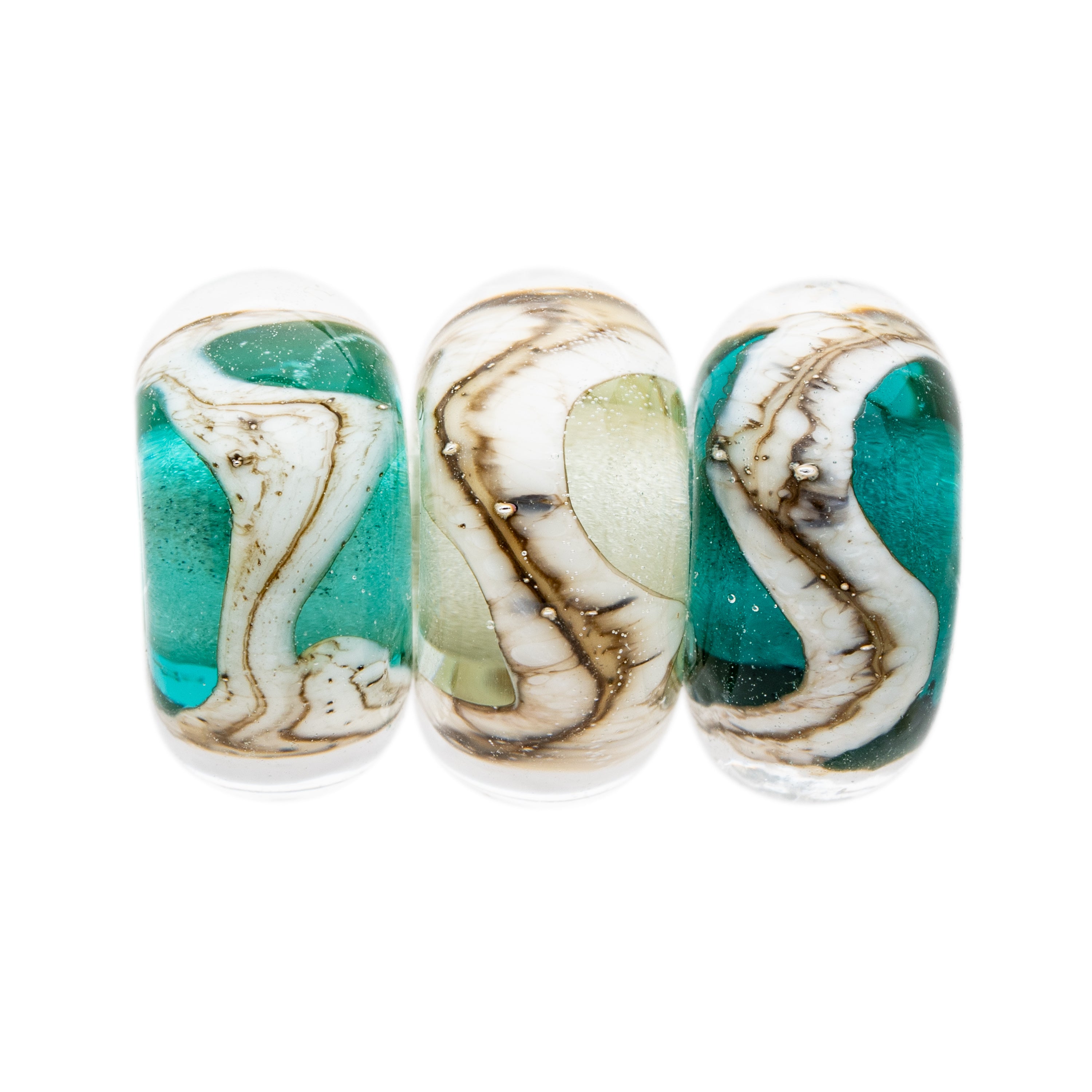 Teal, Sea Glass, Dark Teal glass beads wrapped with swirling silver sand pattern, representing the Cornish coastline.