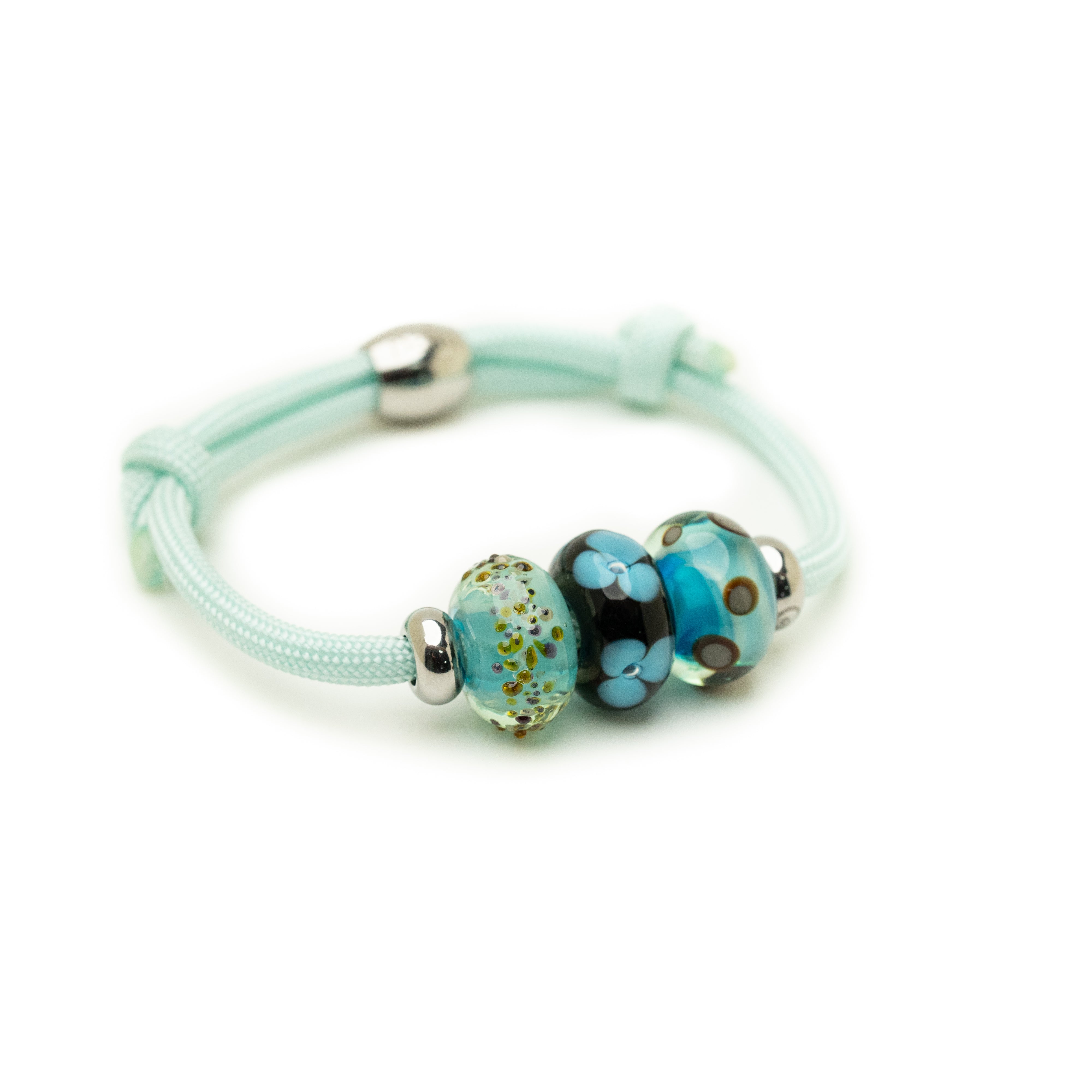 Turquoise bracelet with colorful beads on a white background