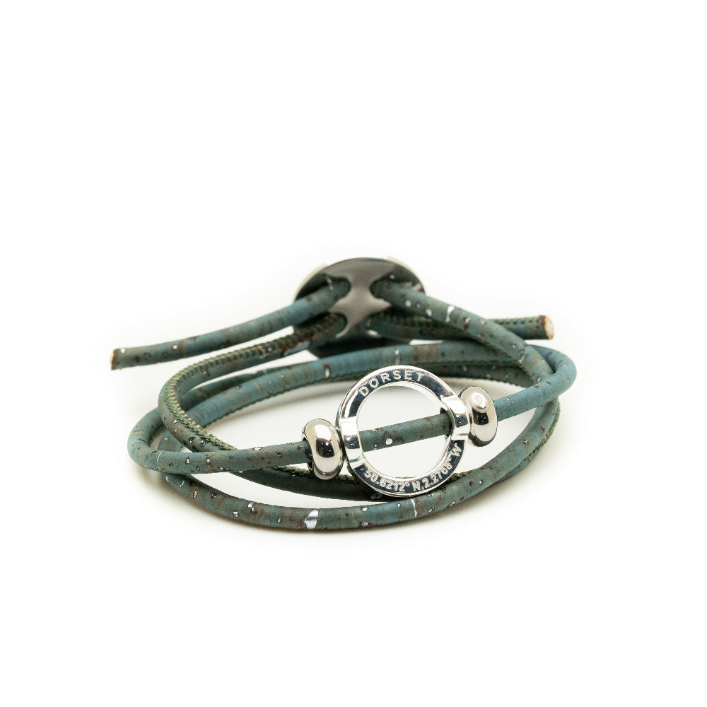 Teal leather bracelet with silver clasp on a white background