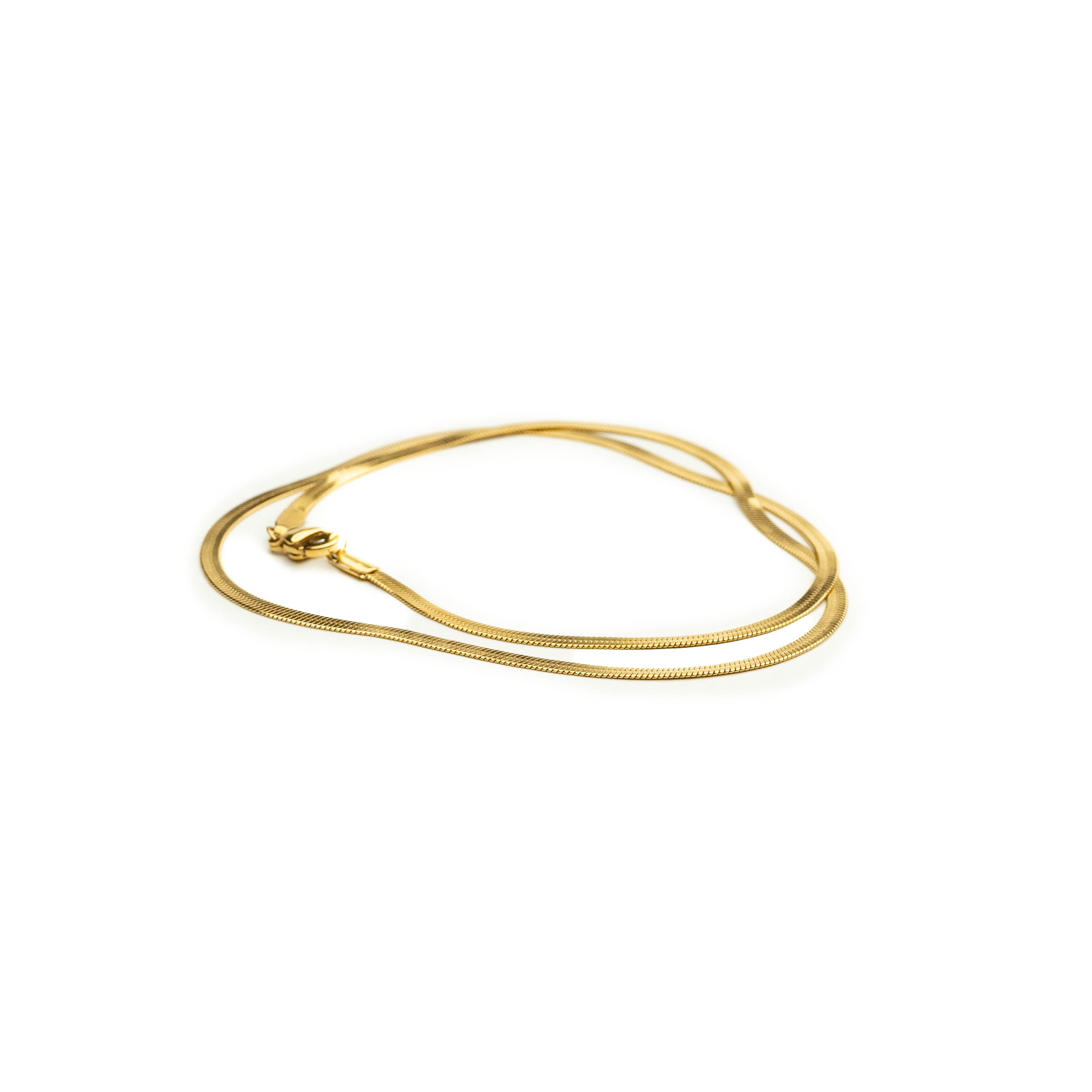 Gold flat snake chain necklace by Nalu.
