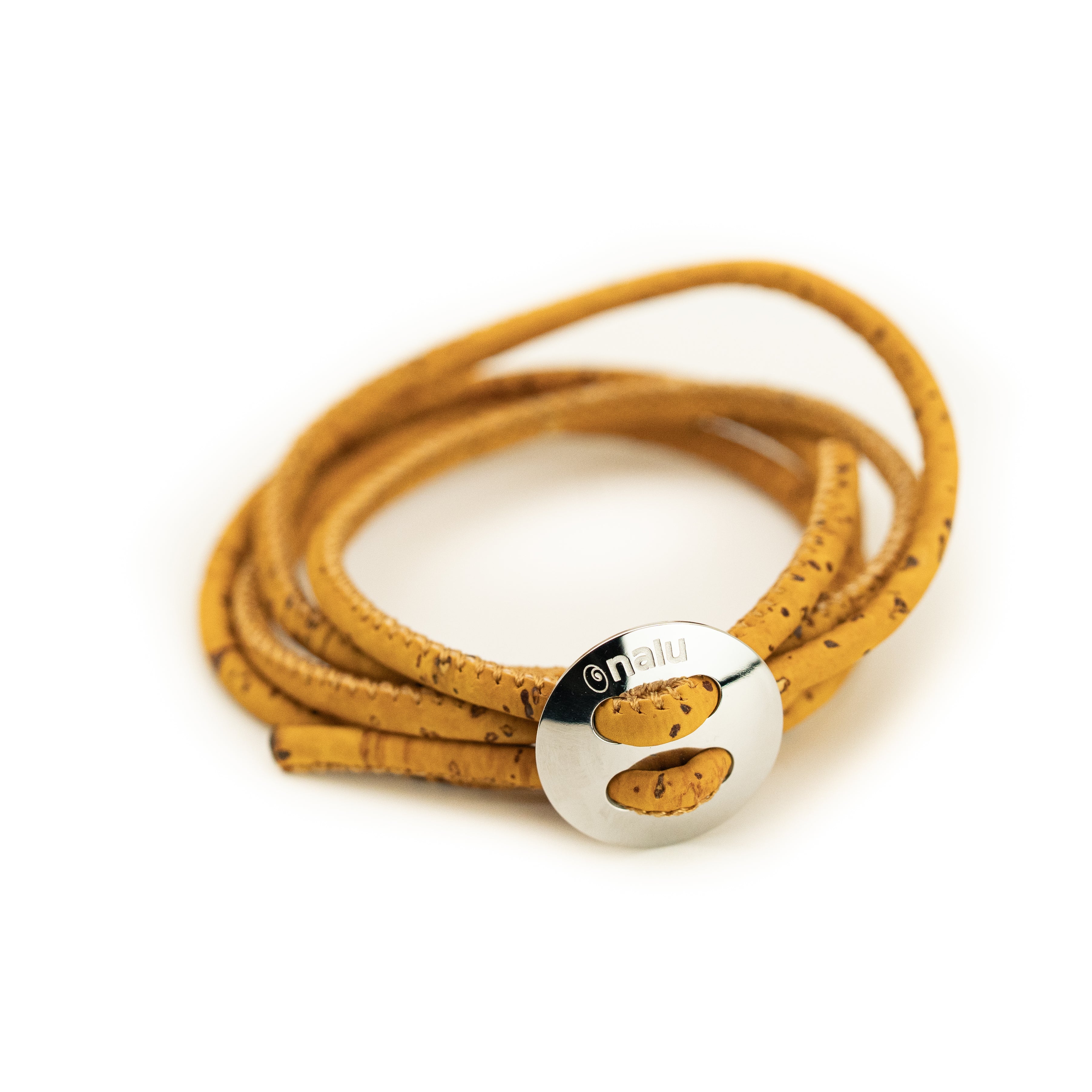 Yellow cork bracelet with a silver clasp on a white background