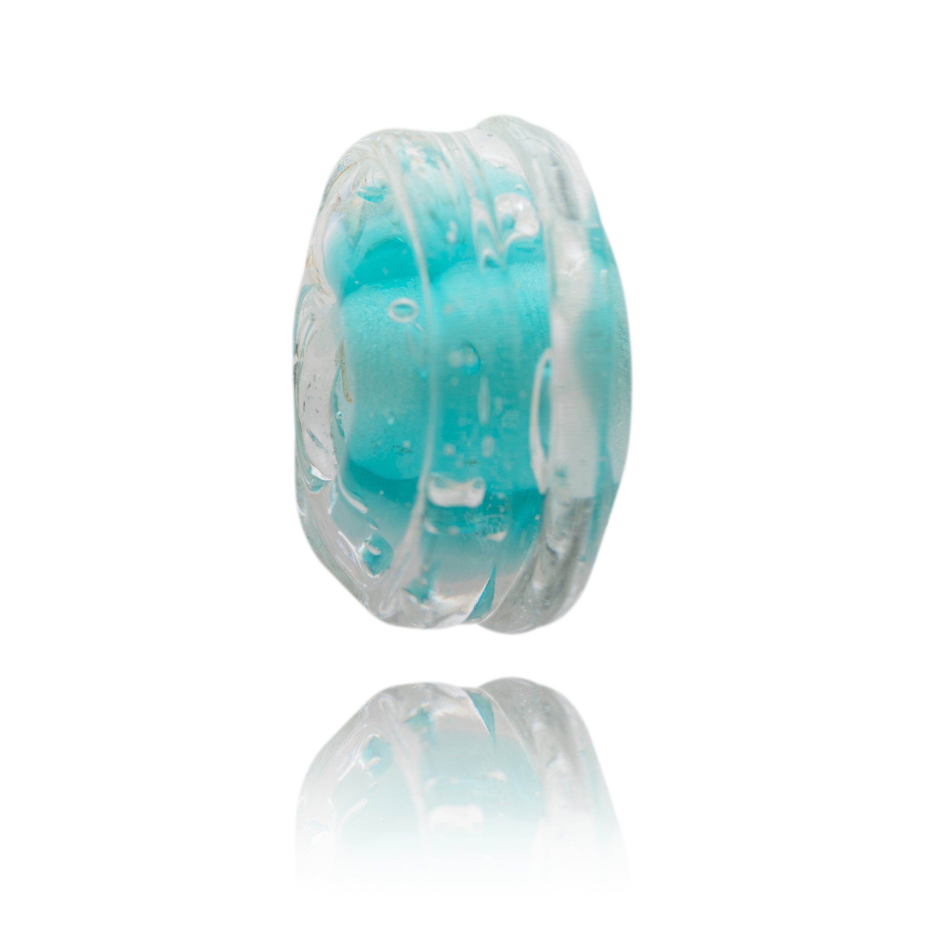 Turquoise glass bead representing Grebe Beach in Cornwall