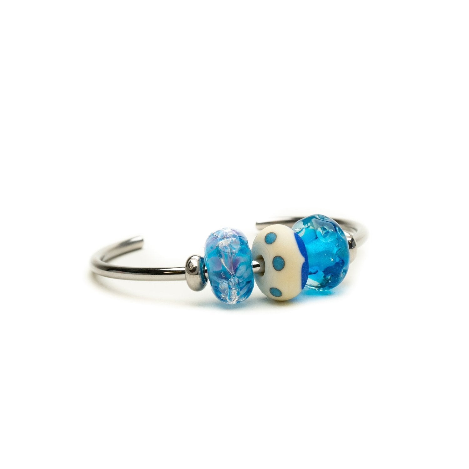 Steel bangle with three blue glass beads on it.