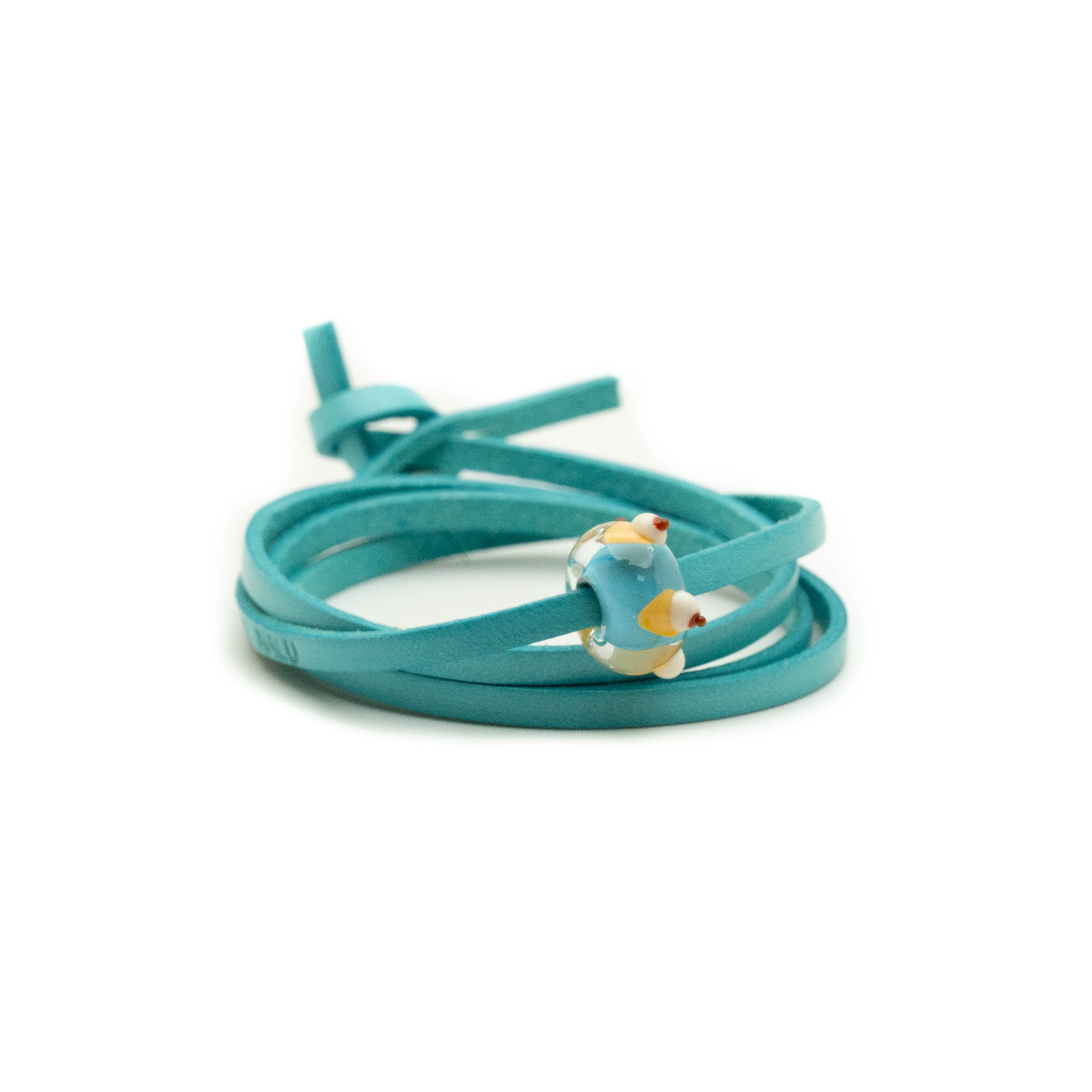 Turquoise leather wrap bracelet with cream bead.