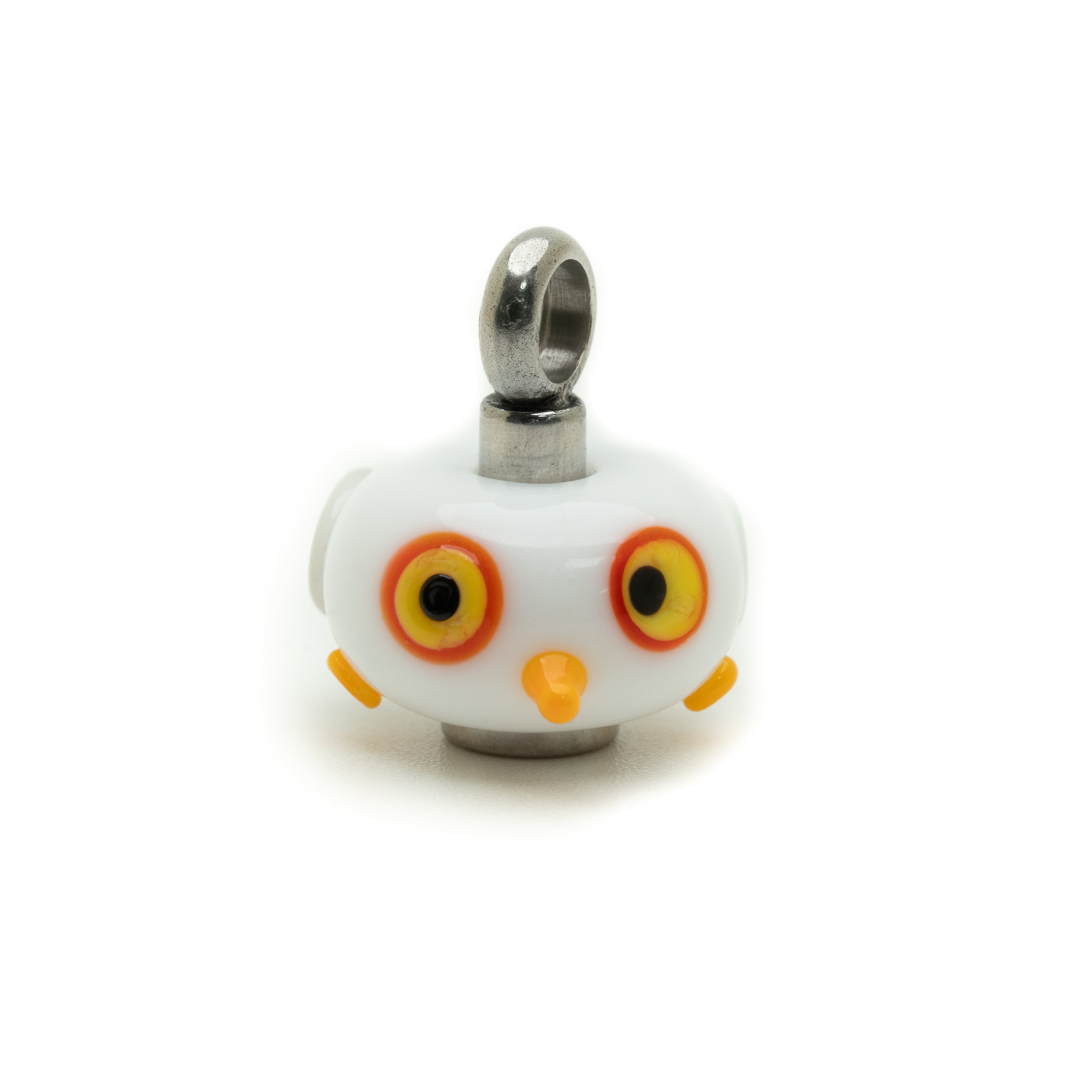 A white seagull-shaped charm with large yellow and orange eyes, a small orange beak, and a silver metal loop at the top, shown on a plain white background.