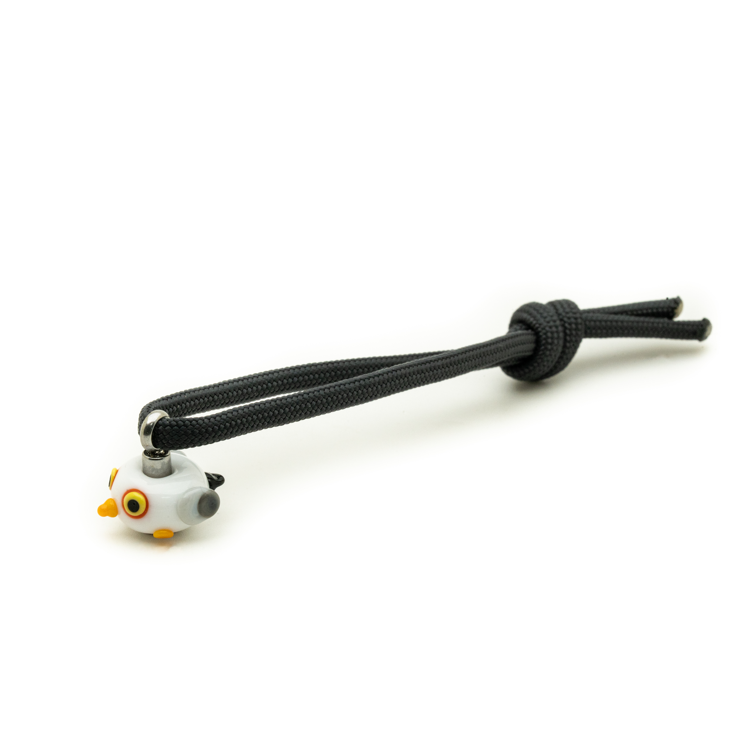 A black paracord keychain with a small seagull-shaped charm, shown on a plain white background.