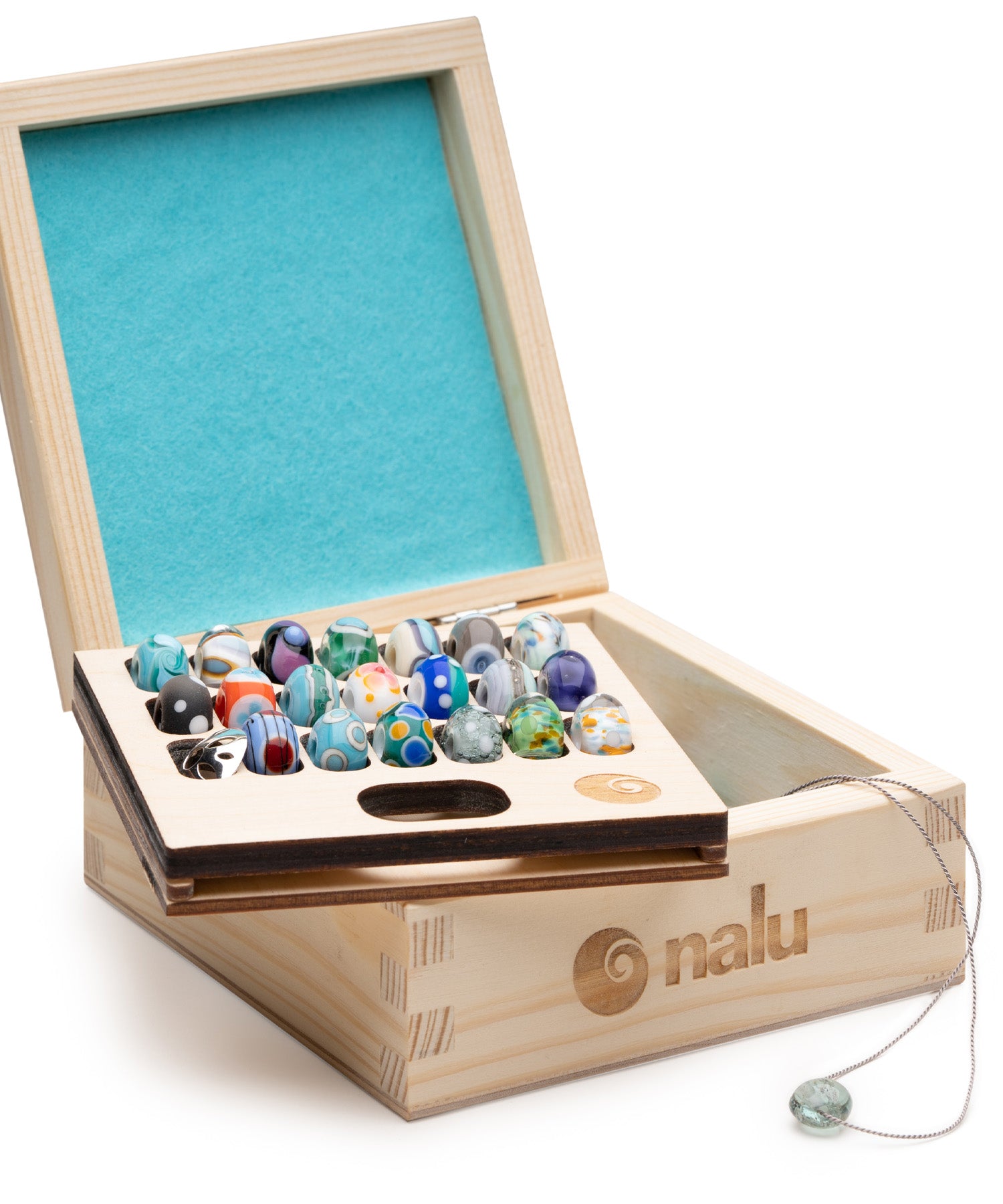 Wooden box with beads and 'nalu' branding on a white background
