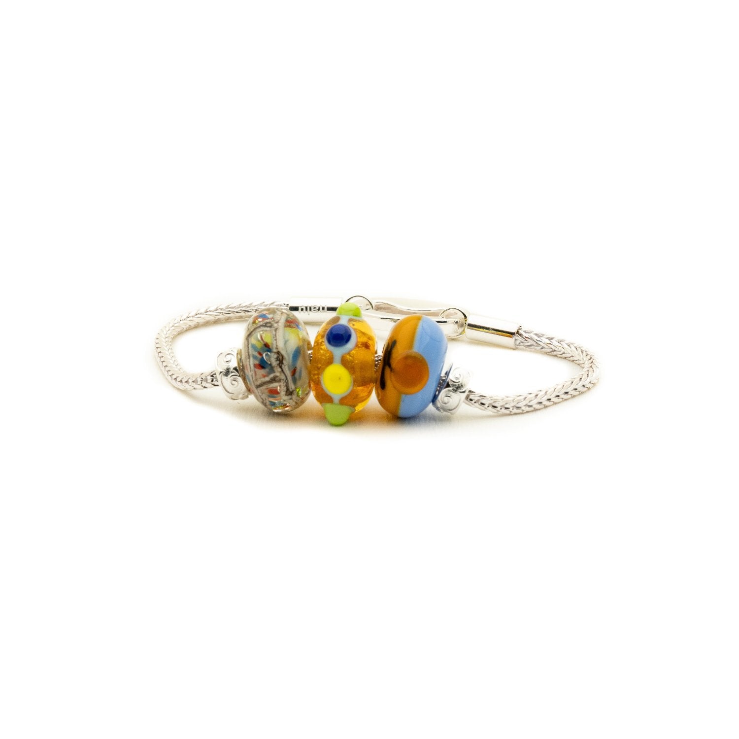 Colourful patterned Murano glass beads on a silver bracelet. representing beaches in Lincolnshire.