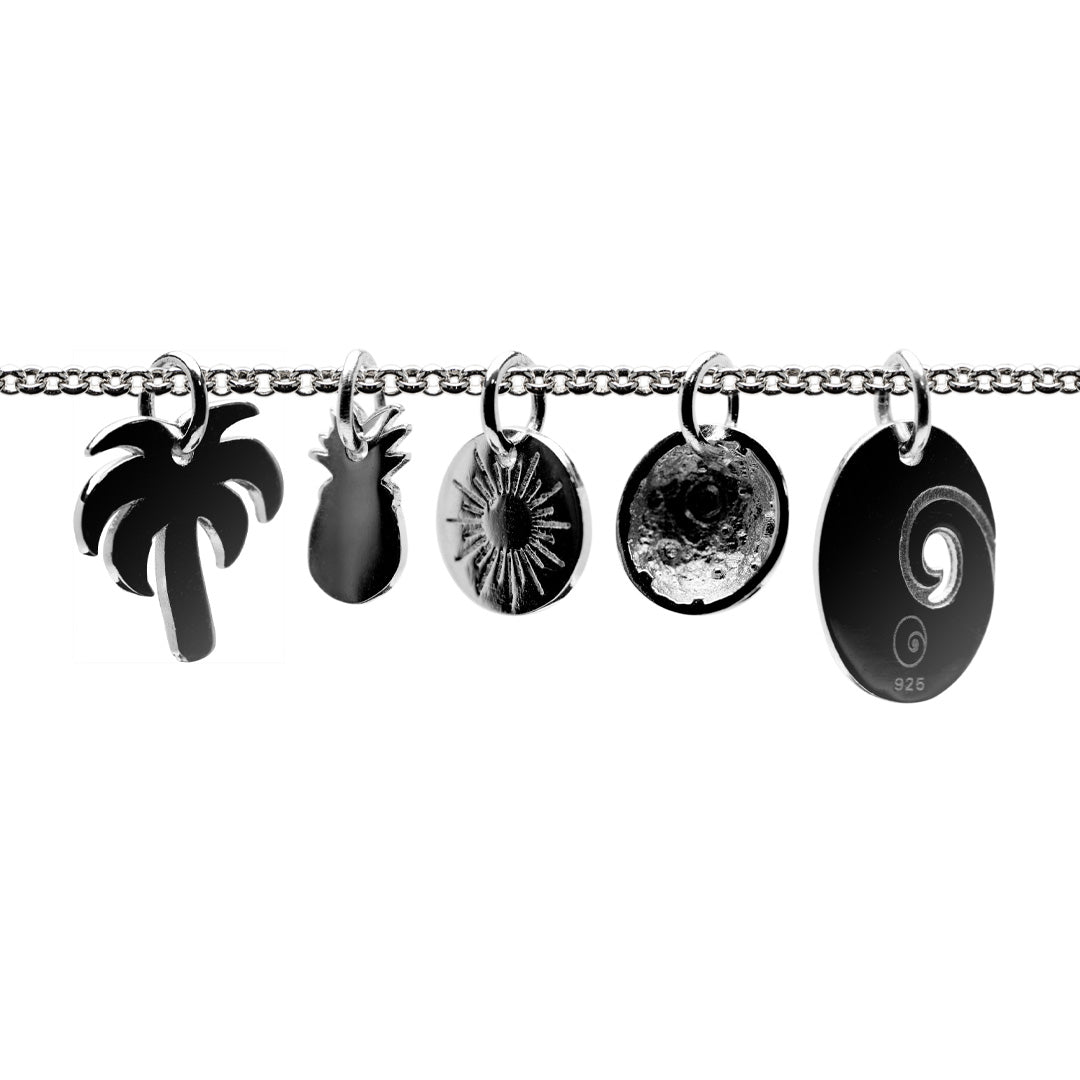 Thin silver chain with silver charms on a white background