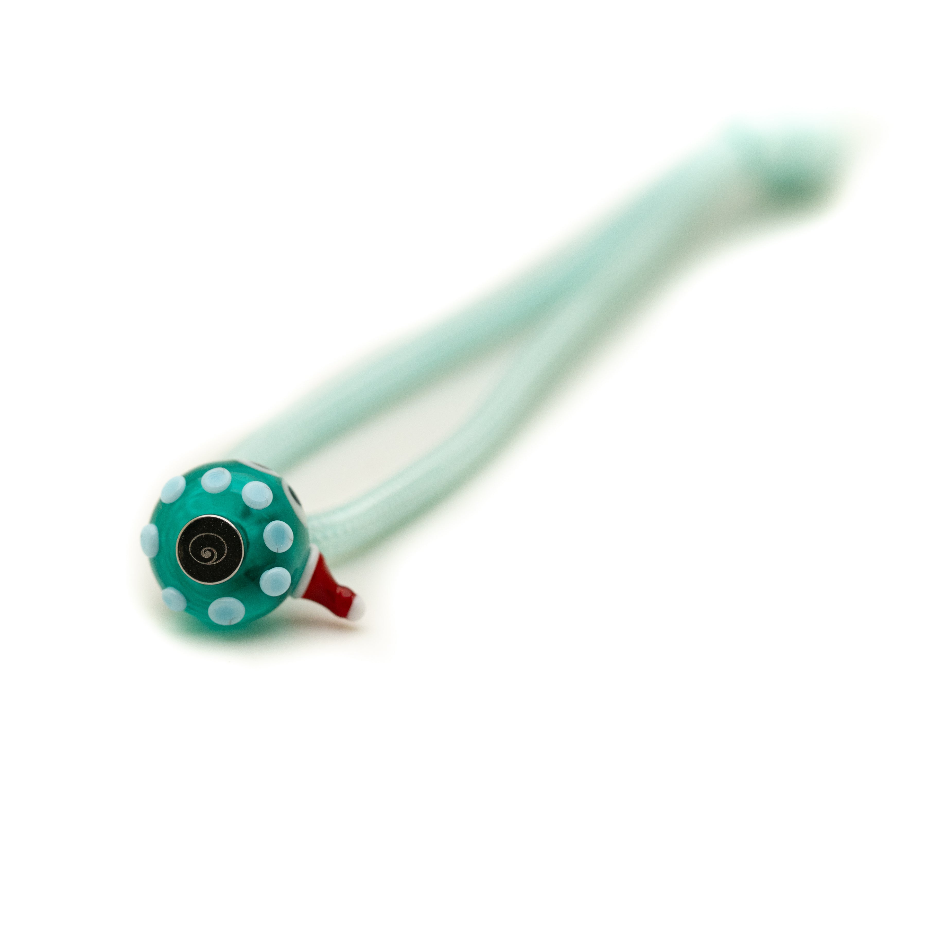 Bottom of bead with blue dots on a string.