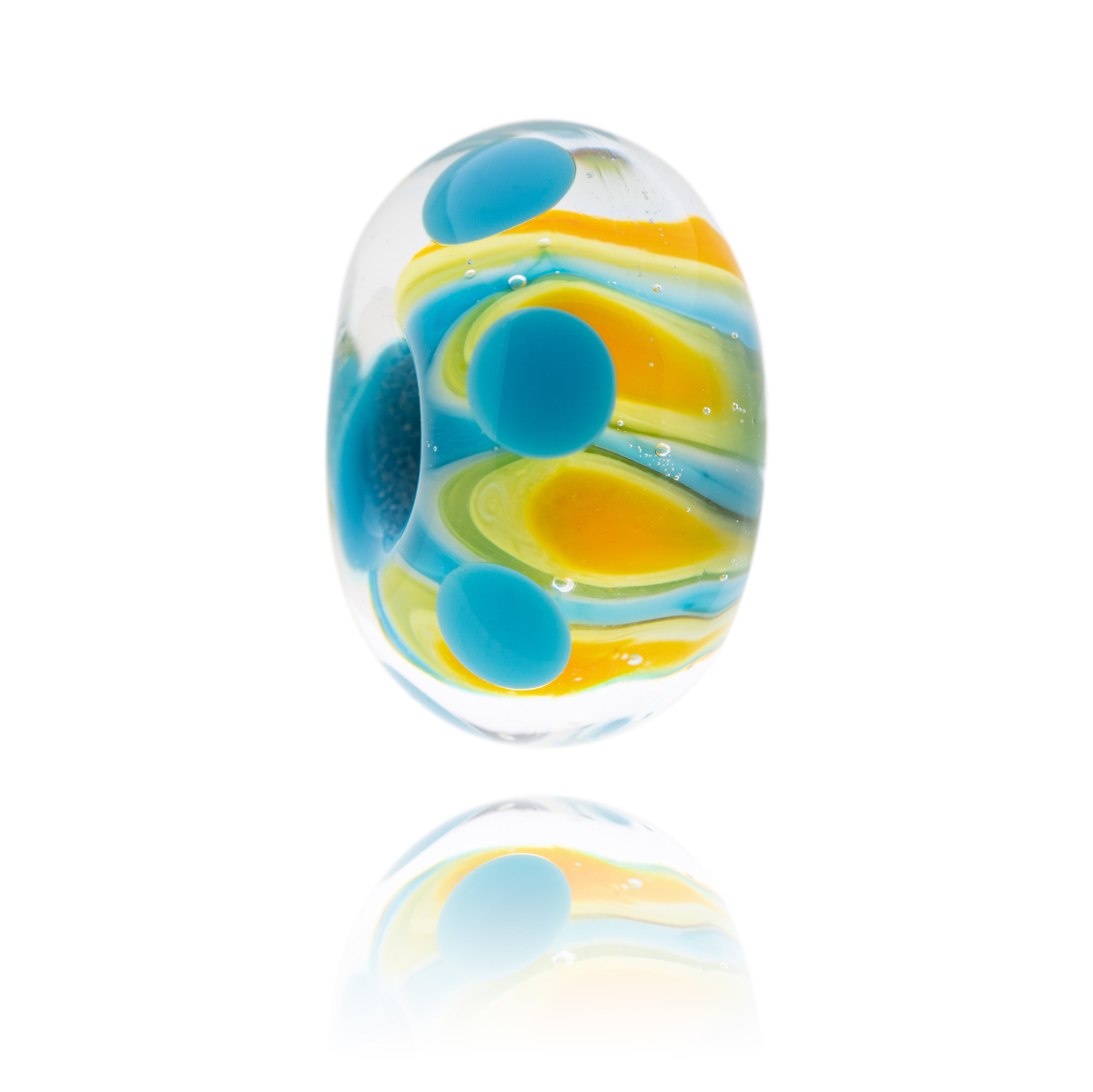 Yellow and orange glass beads with petal shapes and dots on the surface.