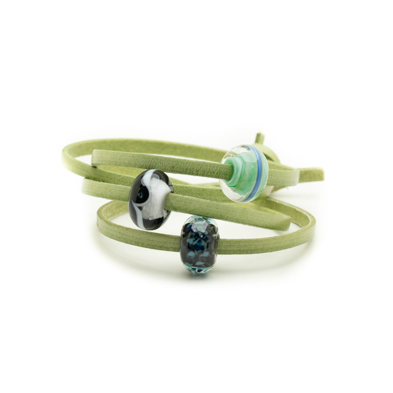 Dark glass beads for Northumberland on a green leather bracelet.