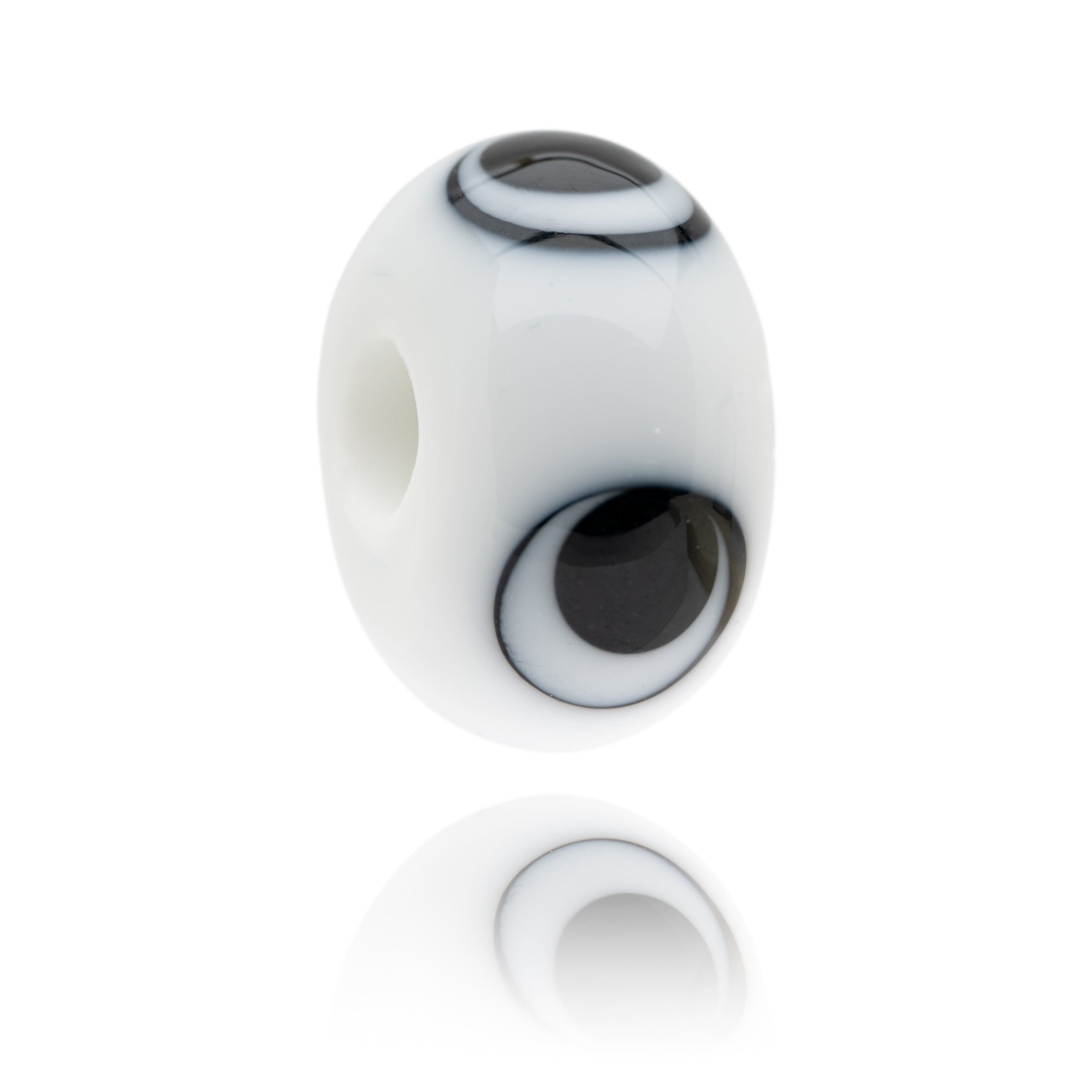 White and black glass bead representing the giant panda being sold to raise funds for the World Wildlife Foundation.