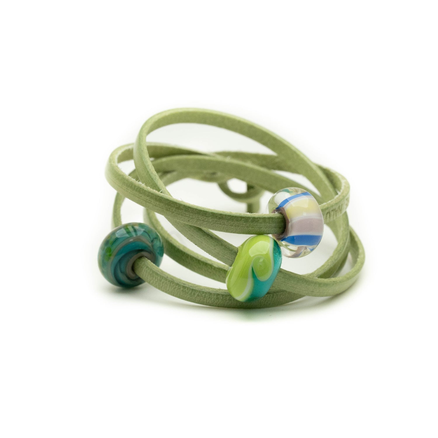 Pembrokeshire coast beads on green leather wrap bracelet.