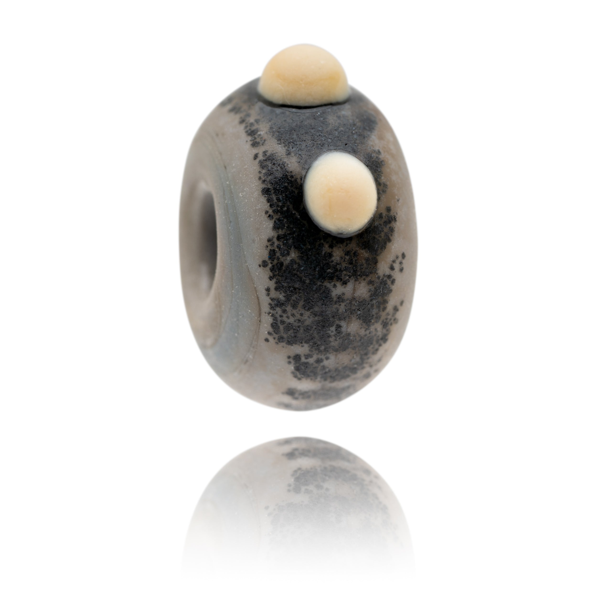 Grey glass bead representing a rhino being sold to raise funds for the World Wildlife Foundation.