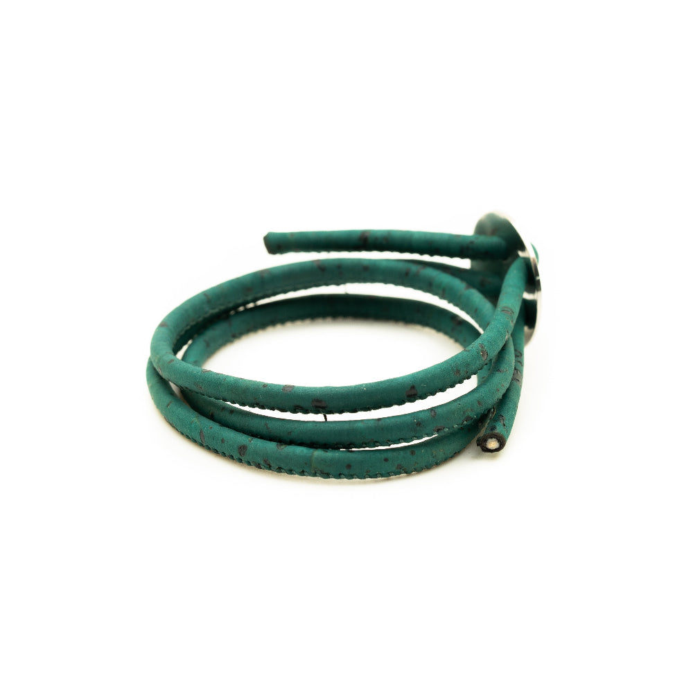 Green leather bracelet on a white background