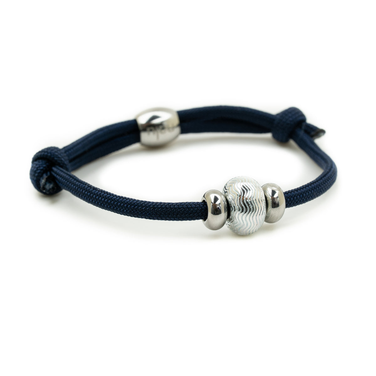 A navy blue cord bracelet with a knotted sliding closure and three polished silver-tone beads, including one textured central bead, shown on a white background.