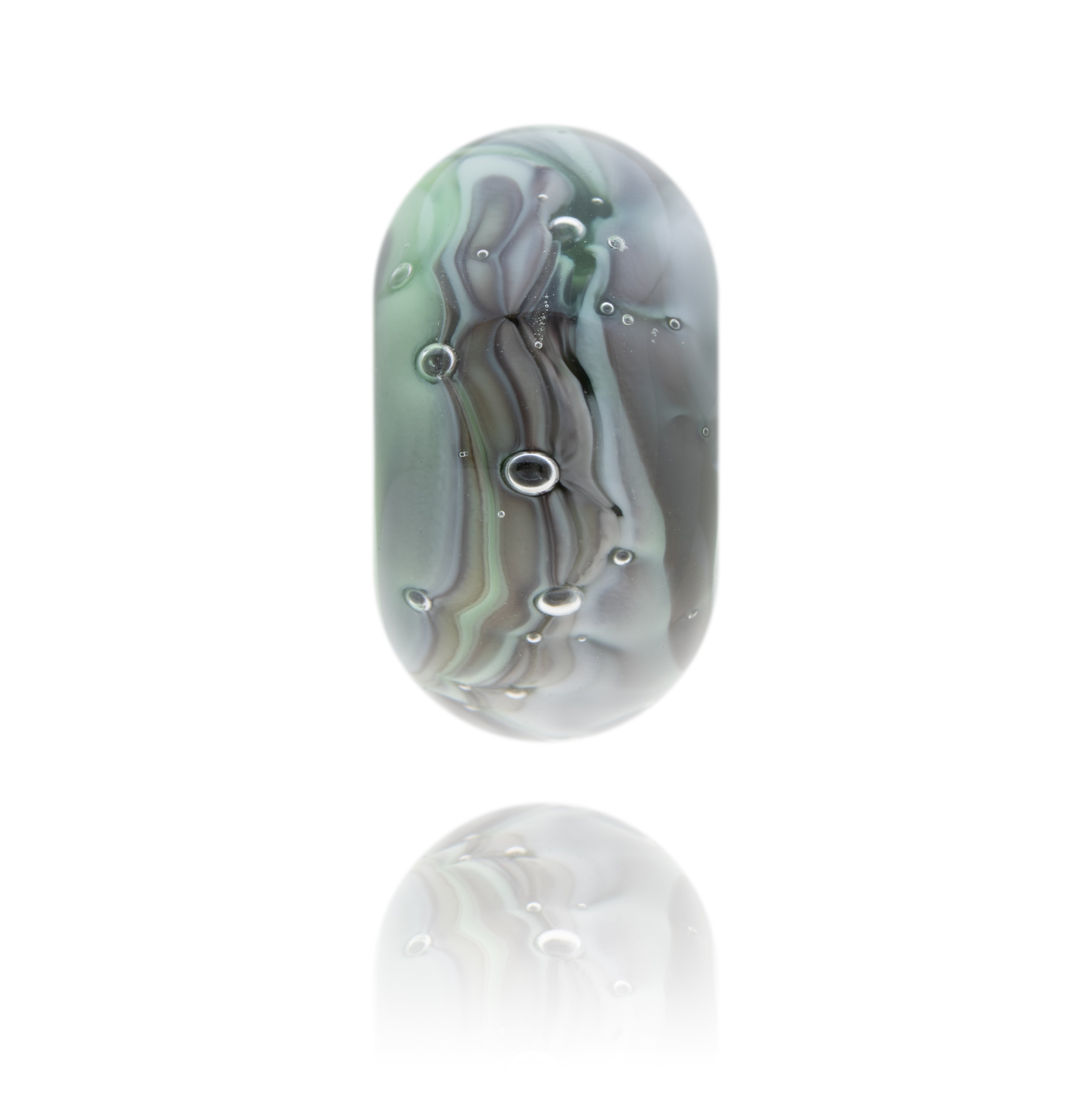 Grey, green and clear glass bead with air bubbles in the bead. Representing watches in Somerset.