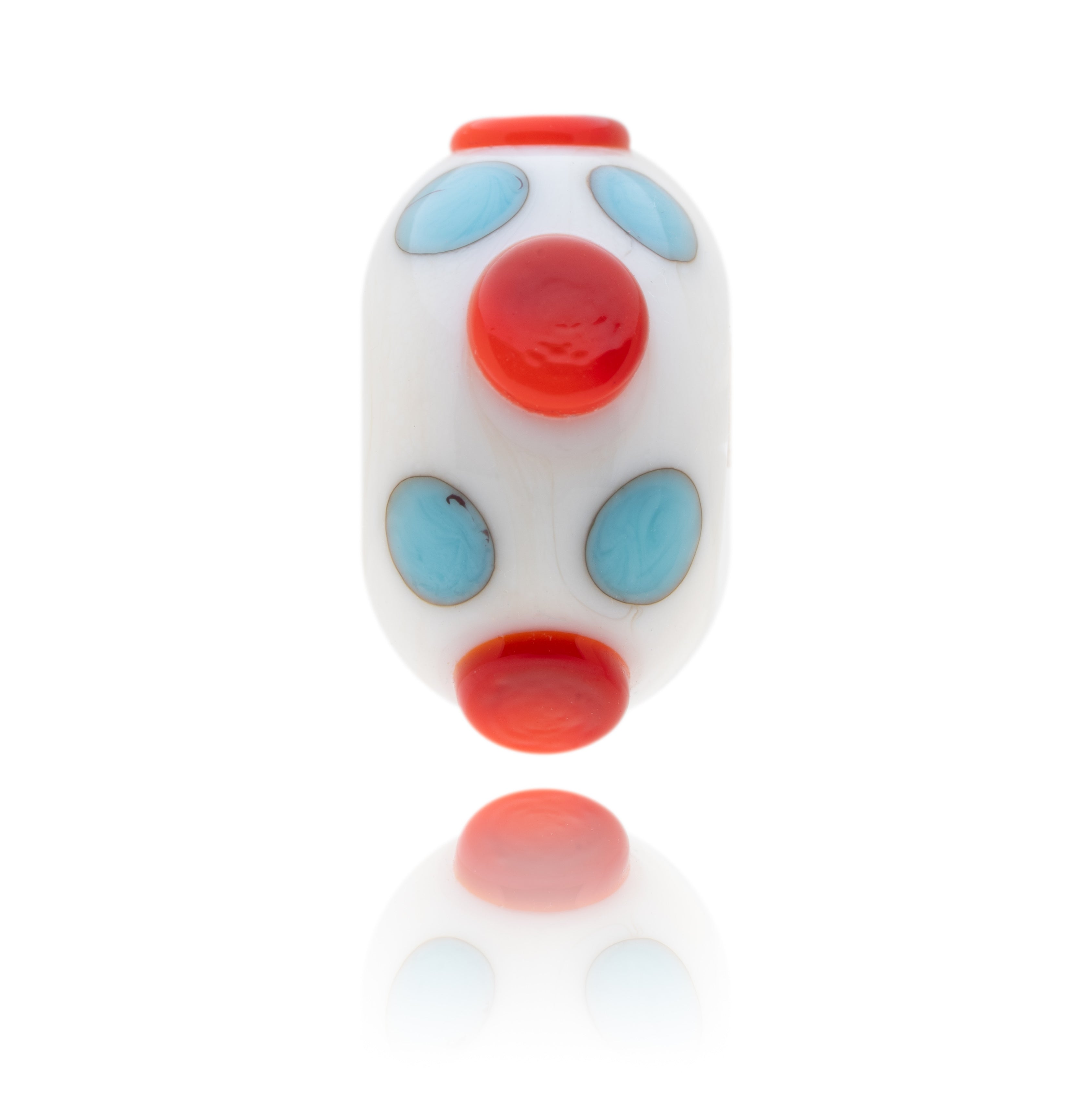 Light ivory coloured glass bead decorated with little turquoise and larger red dots to represent Weston-super-Mare in Somerset.