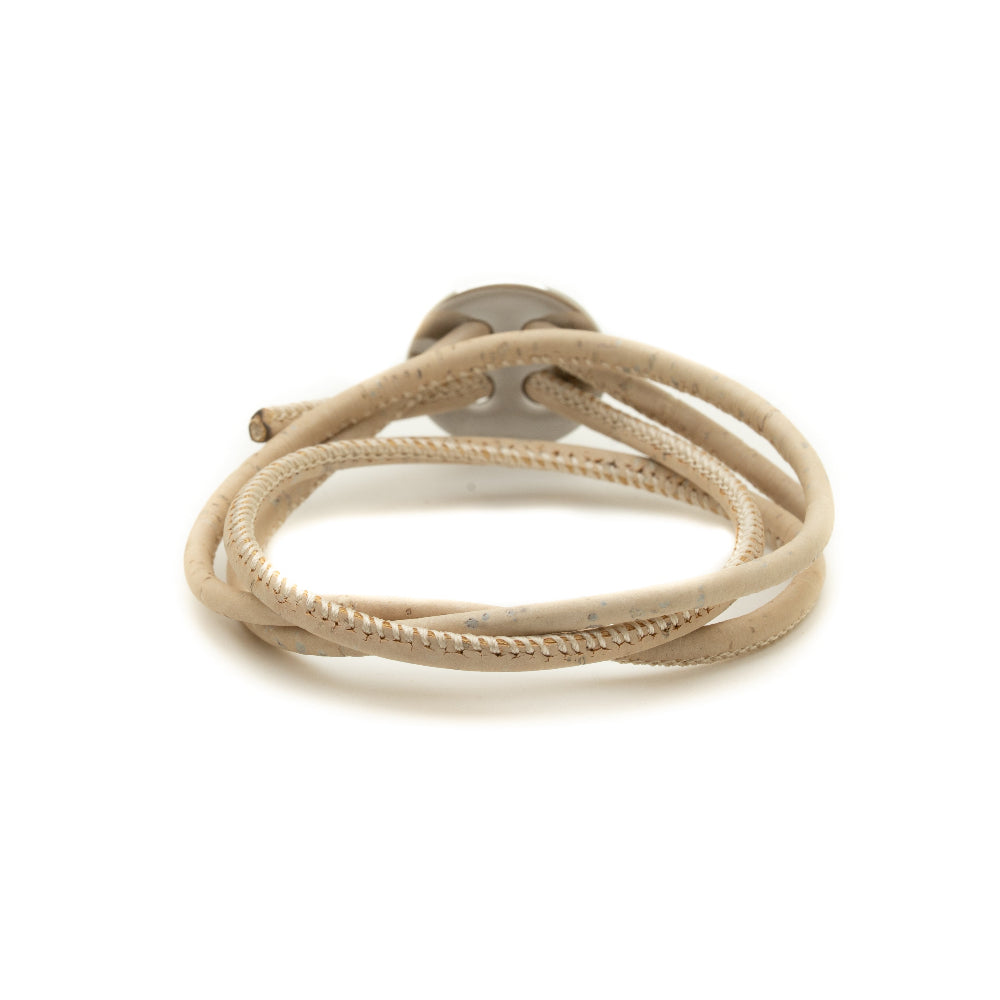 Beige braided cord with a metal clip on a white background