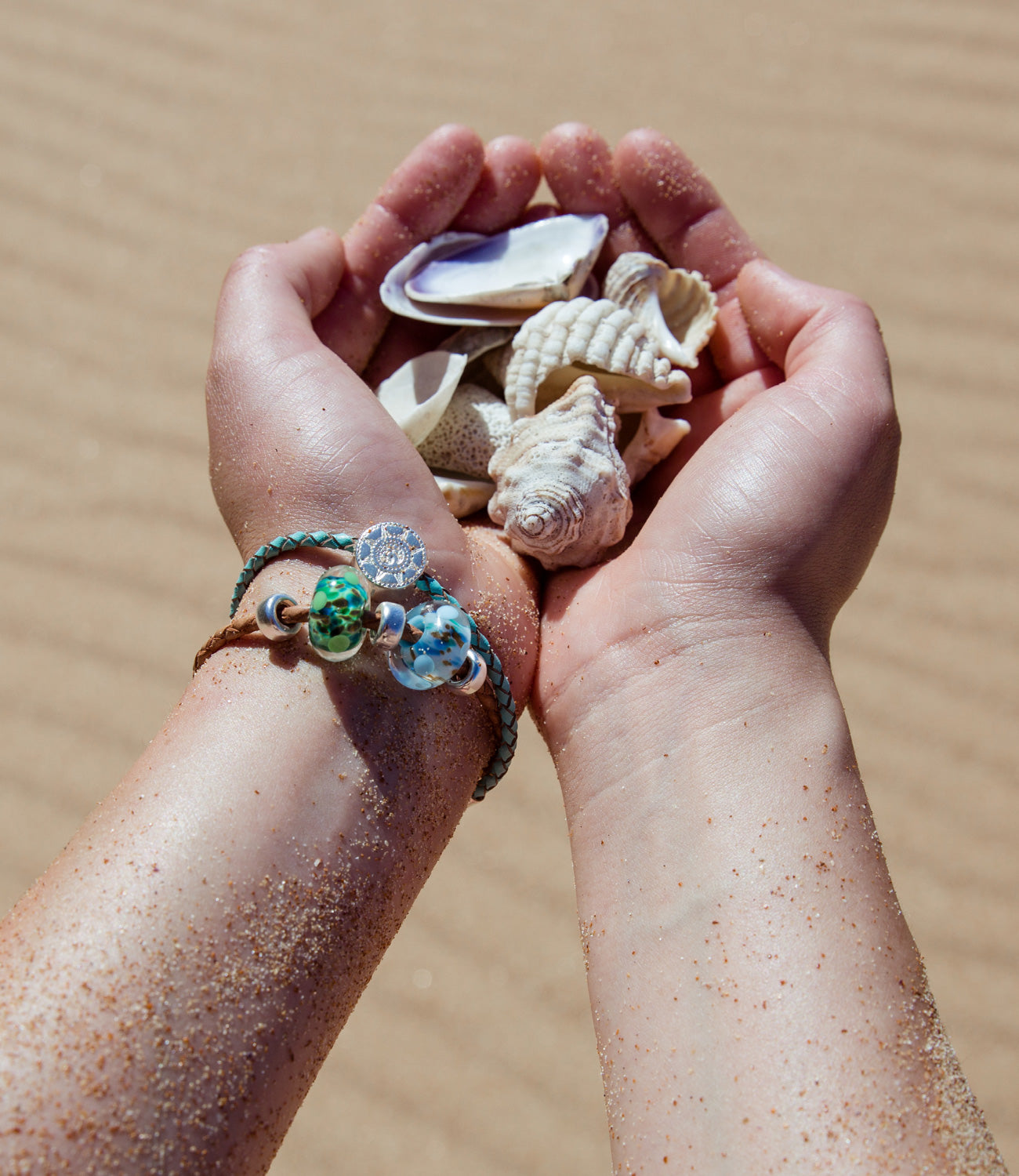 Jersey and Guernsey surf collection beads on bracelet, collecting shells on the beach.