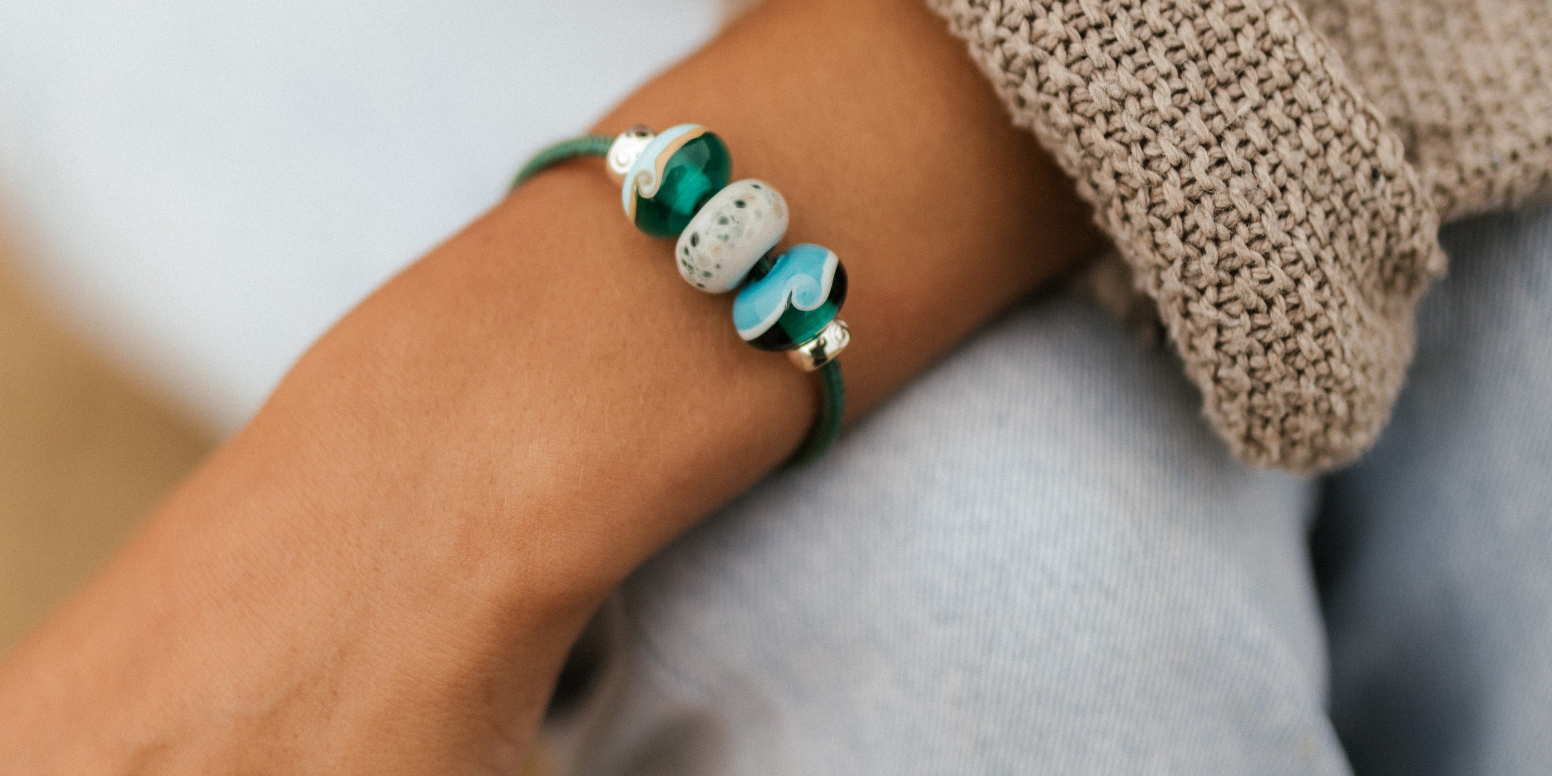 SAS, Seal Sanctuary and ND Biosphere Nalu charity collection beads on bracelet.