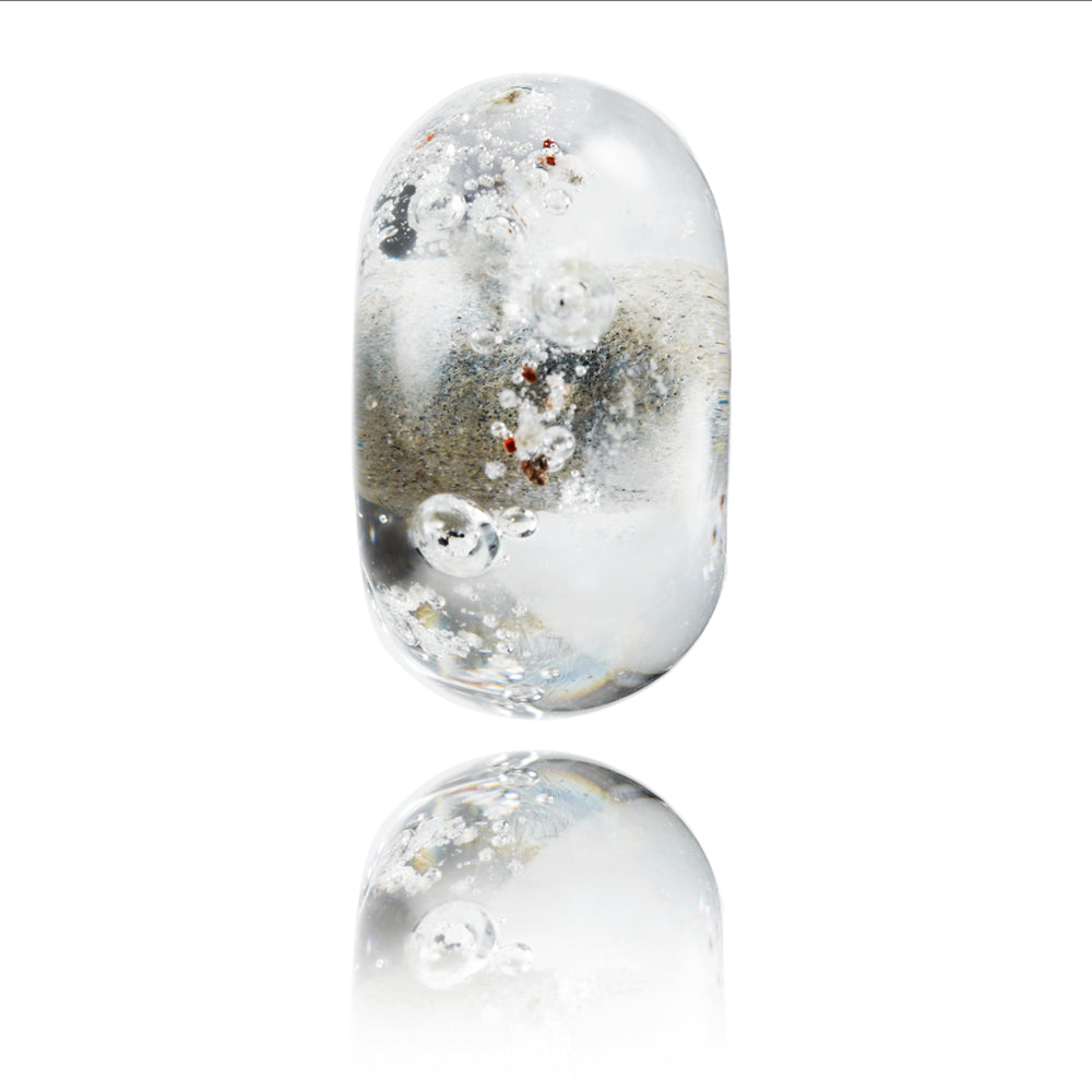 Clear glass lamp work beads with ashes rolled into the glass.