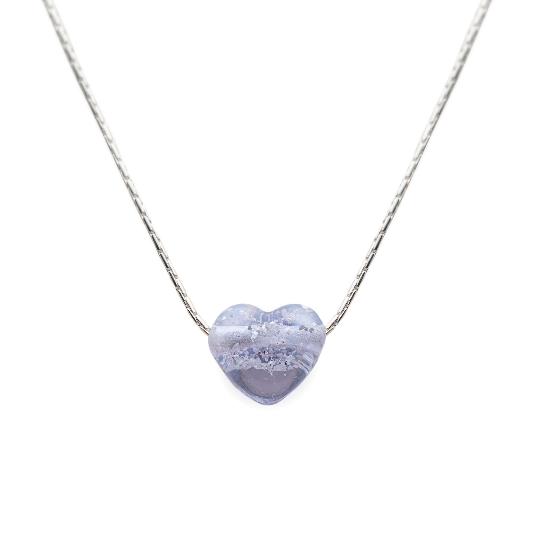 Heart-shaped purple pendant on a silver chain against a white background