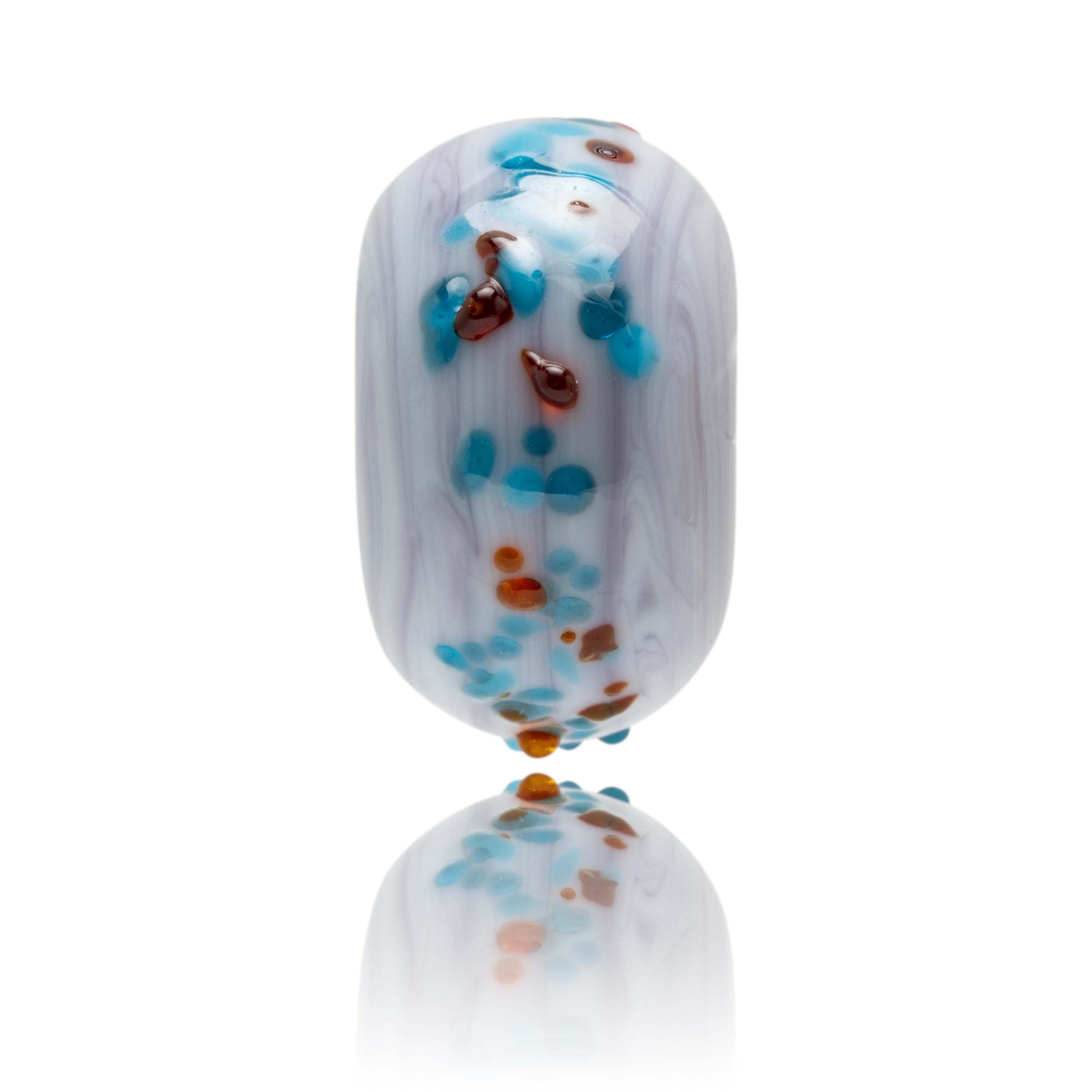 Swirling marble purple glass with small shards or red and blue glass on the surface of the bead.