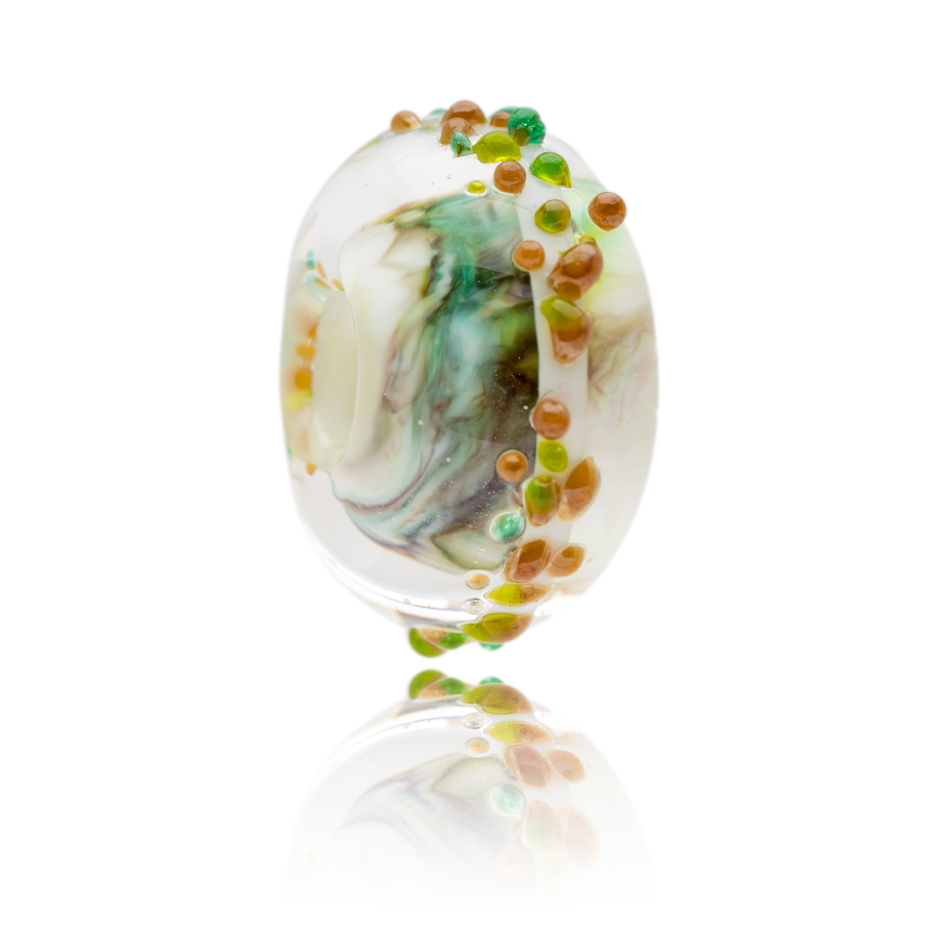 Brown, green, yellow, white swirling glass bead charm inspired by Allenheads snow resort in Cumbria, UK.