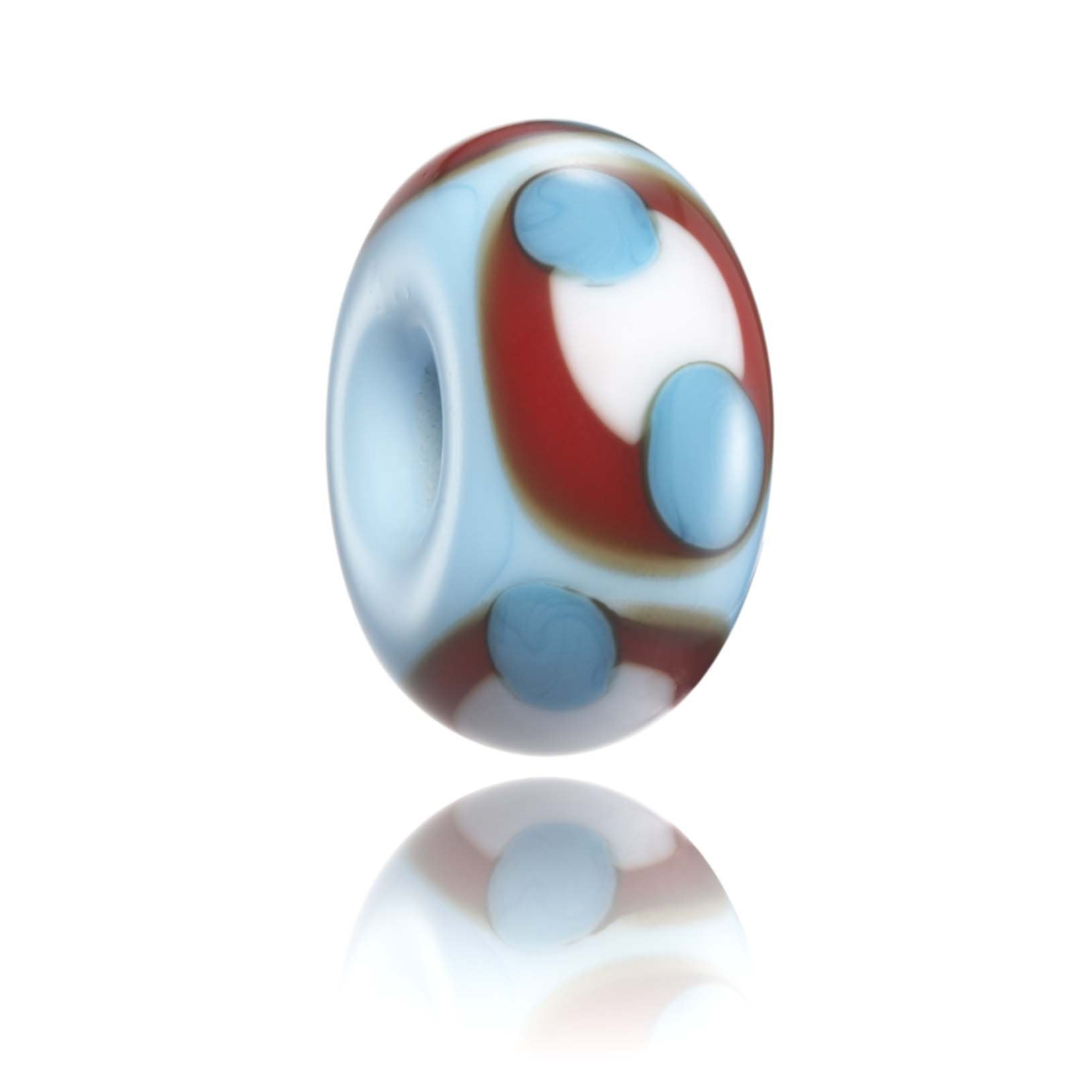 Blue glass bead with white and red dot patterns on surface. Representing Brighton Beach in the UK.