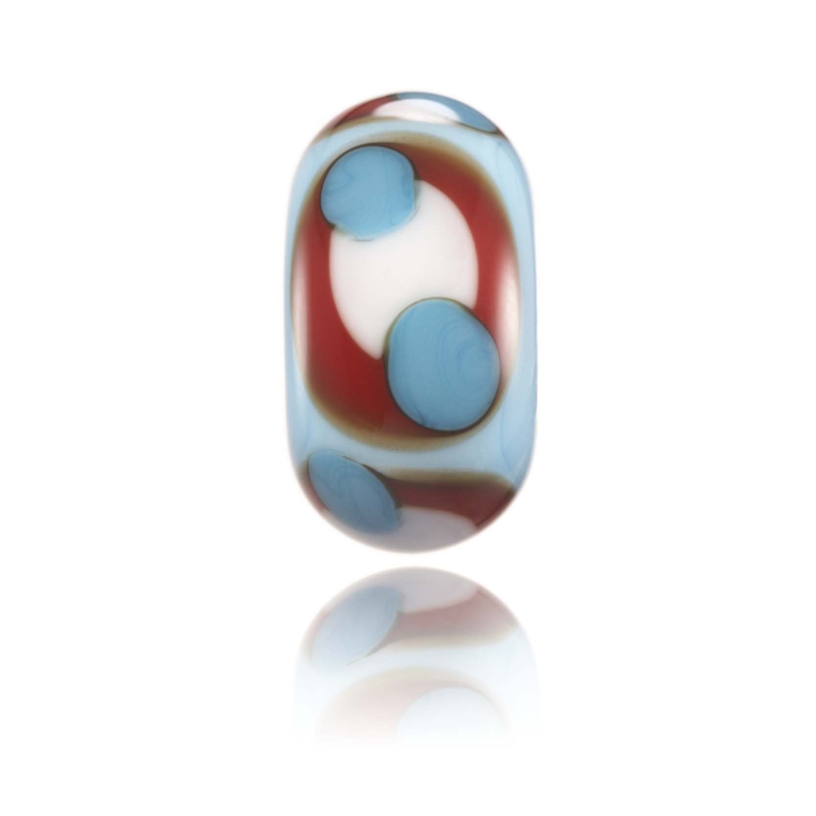 Blue glass bead with white and red dot patterns on surface. Representing Brighton Beach in the UK.