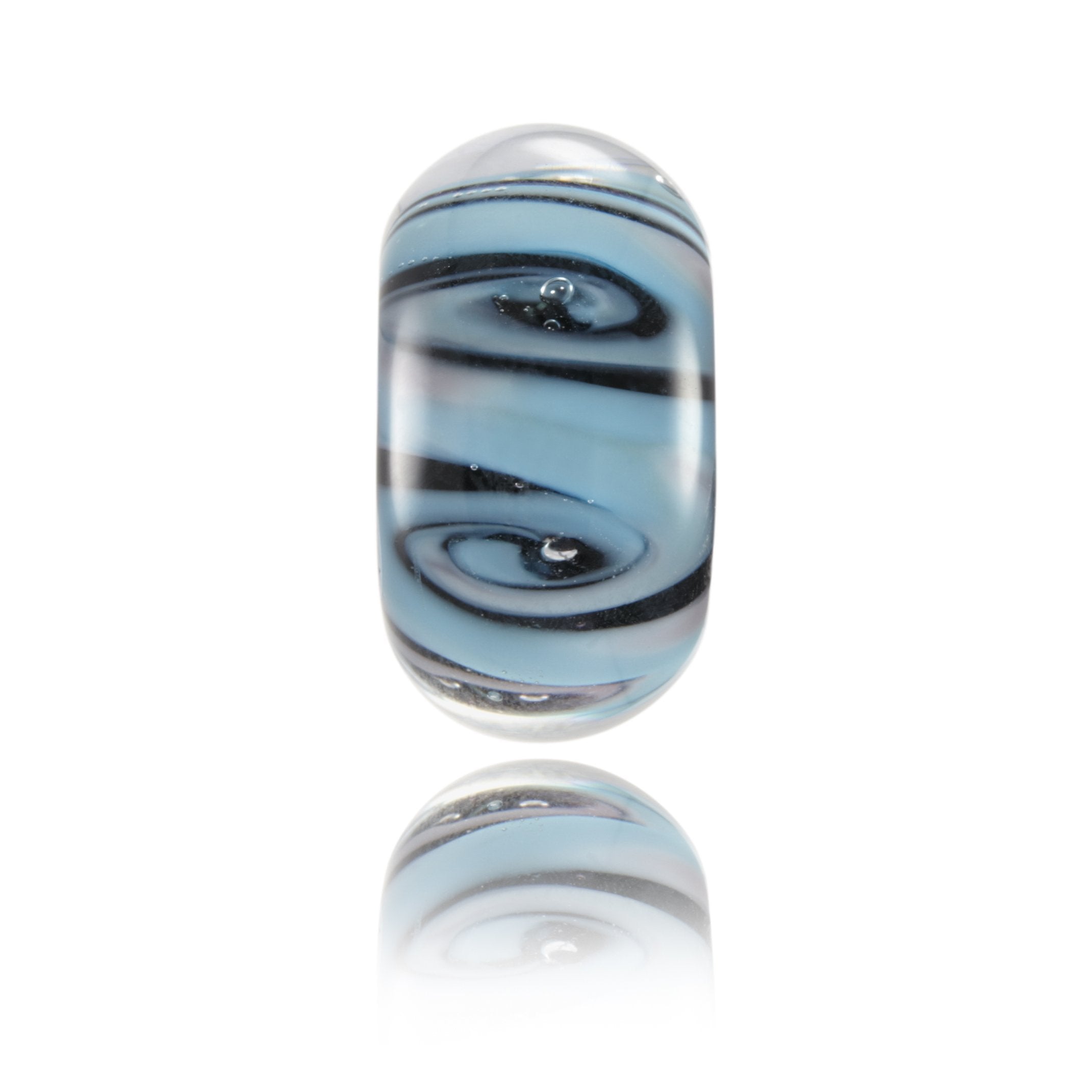 Blue, purple and black glass swirling bead representing Biarritz in France - angle.