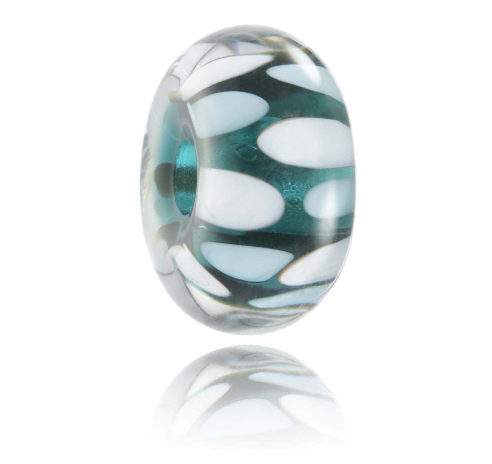 Green glass bead with white and pale blue dot patterns, representing Portreath beach in Cornwall, UK.