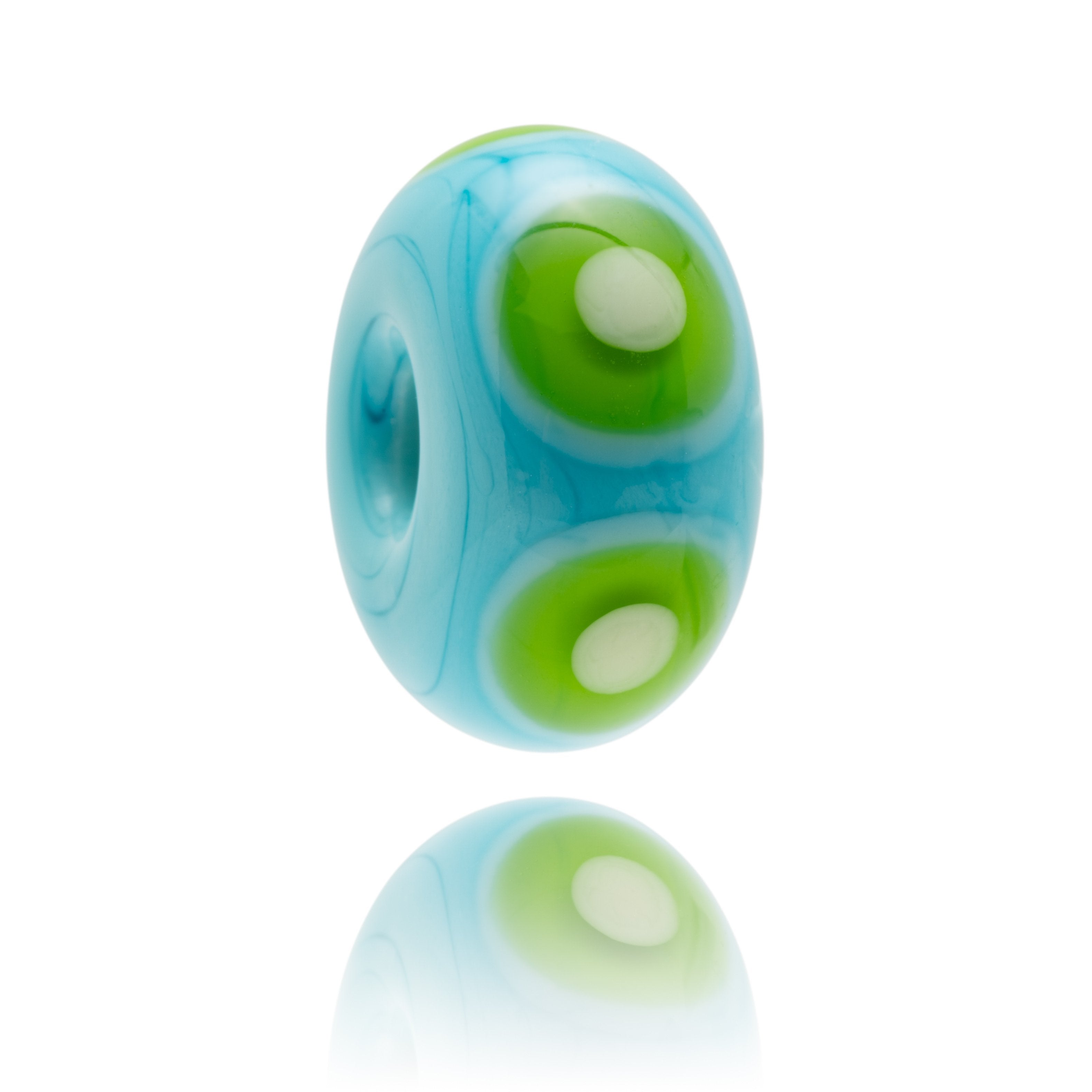 Turquoise and green glass bead with dot patterns representing Bantham Bay In Devon