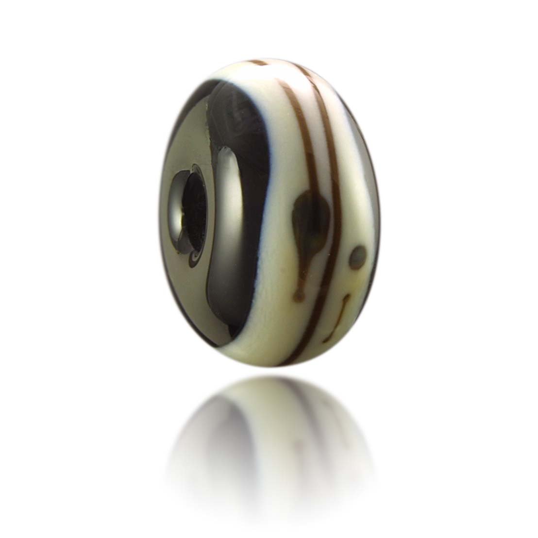 Black and cream glass bead representing Barricade Beach in Woolacombe North Devon